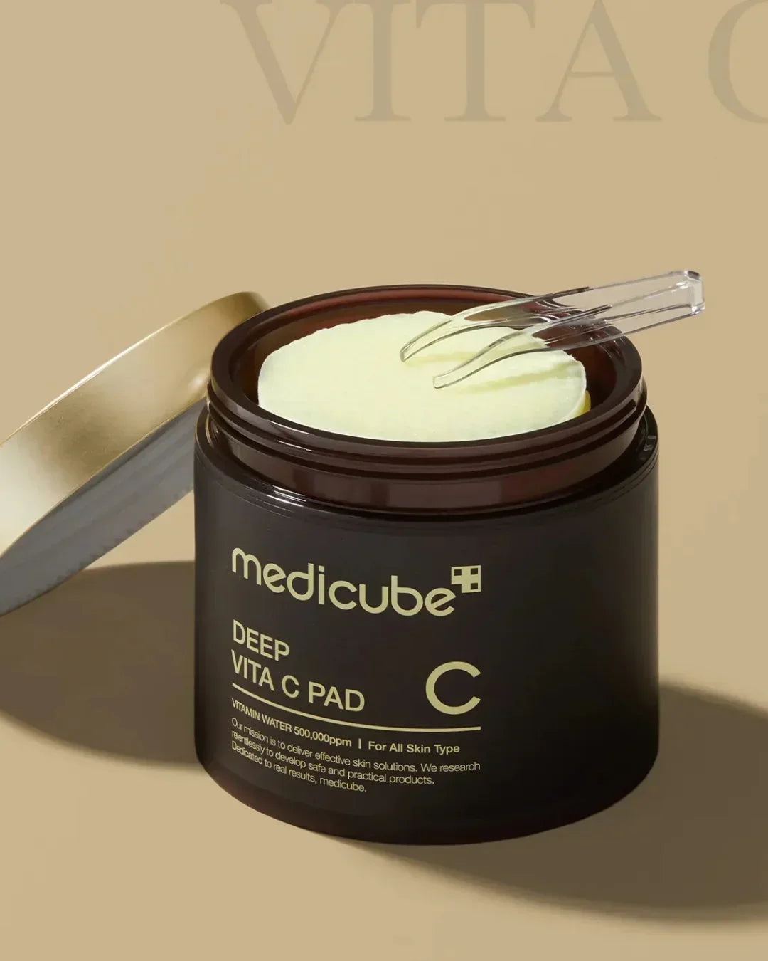 Medicube Deep Vita C Pad skincare product jar with vitamin C pads and transparent tweezer