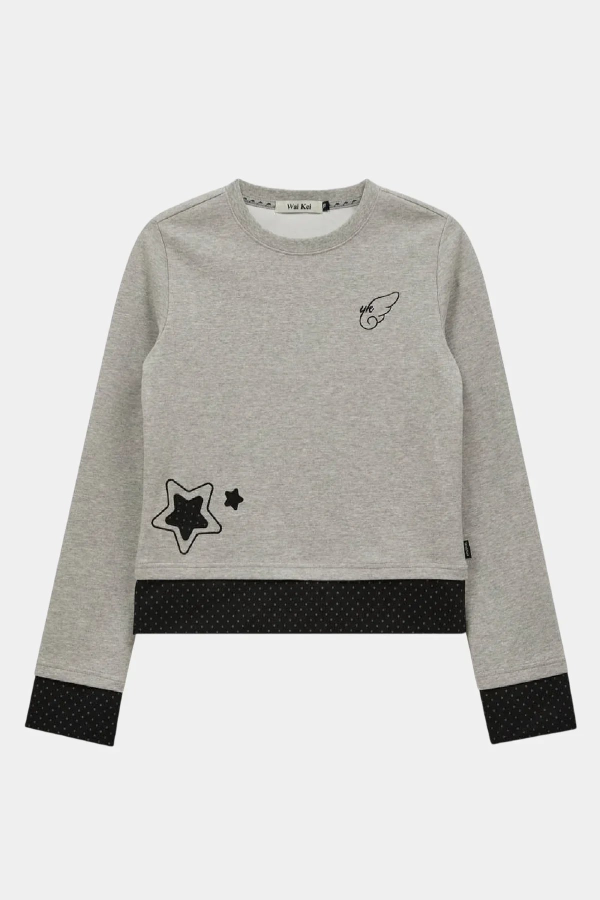Grey long sleeve T-shirt with black star appliques and wing logo on chest, black polka dot cuffs and hem