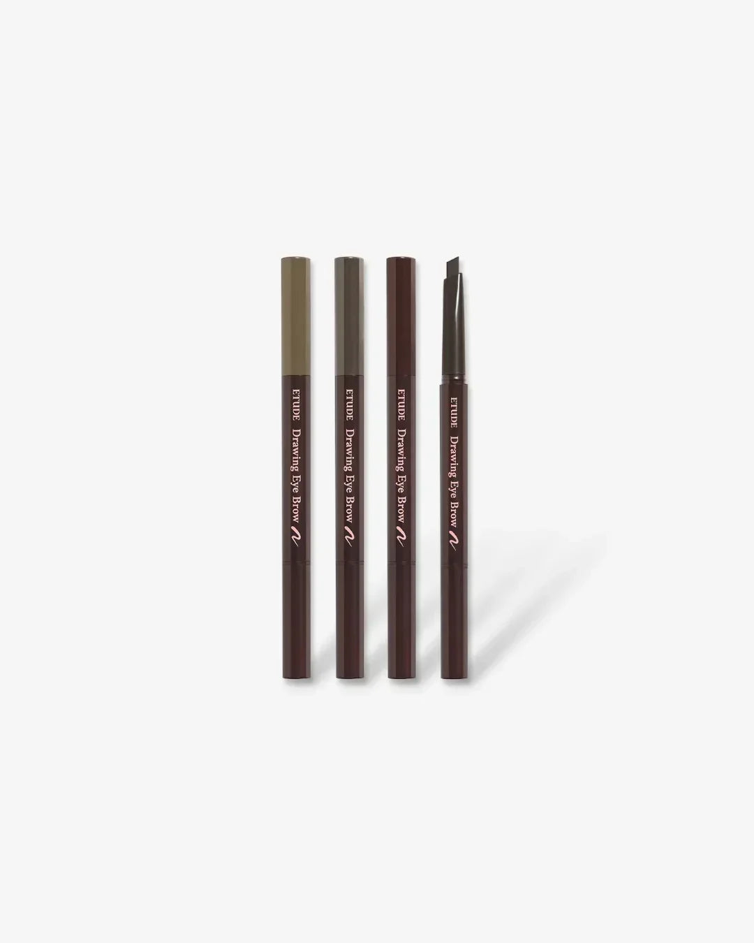 Four Etude Drawing Eye Brow pencils in different shades with one pencil tip exposed on white background