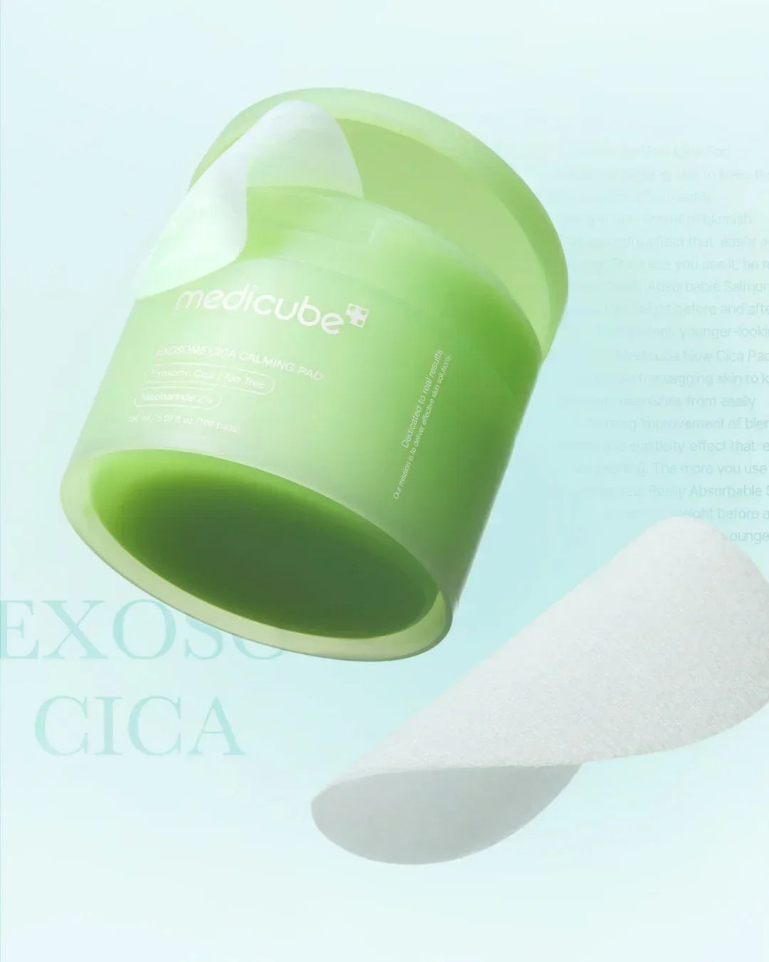Green container of Medicube Exosome Cica Calming Pads with a single white cotton pad
