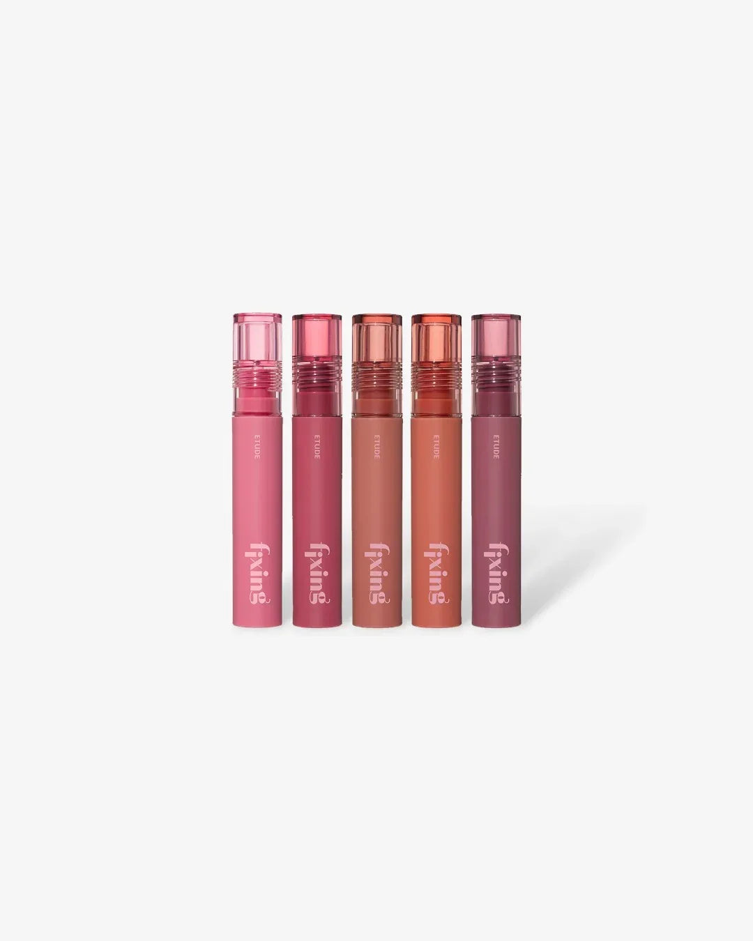 Five Etude Fixing lip tint tubes in varying pink and brown shades on white background