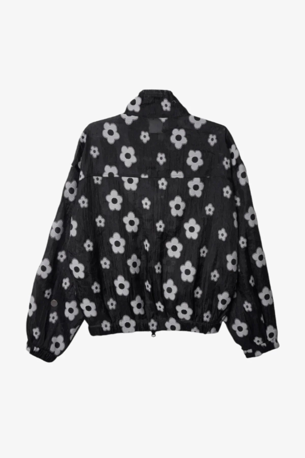 Black zip-up jacket with white flower print and elastic waistband shown from back