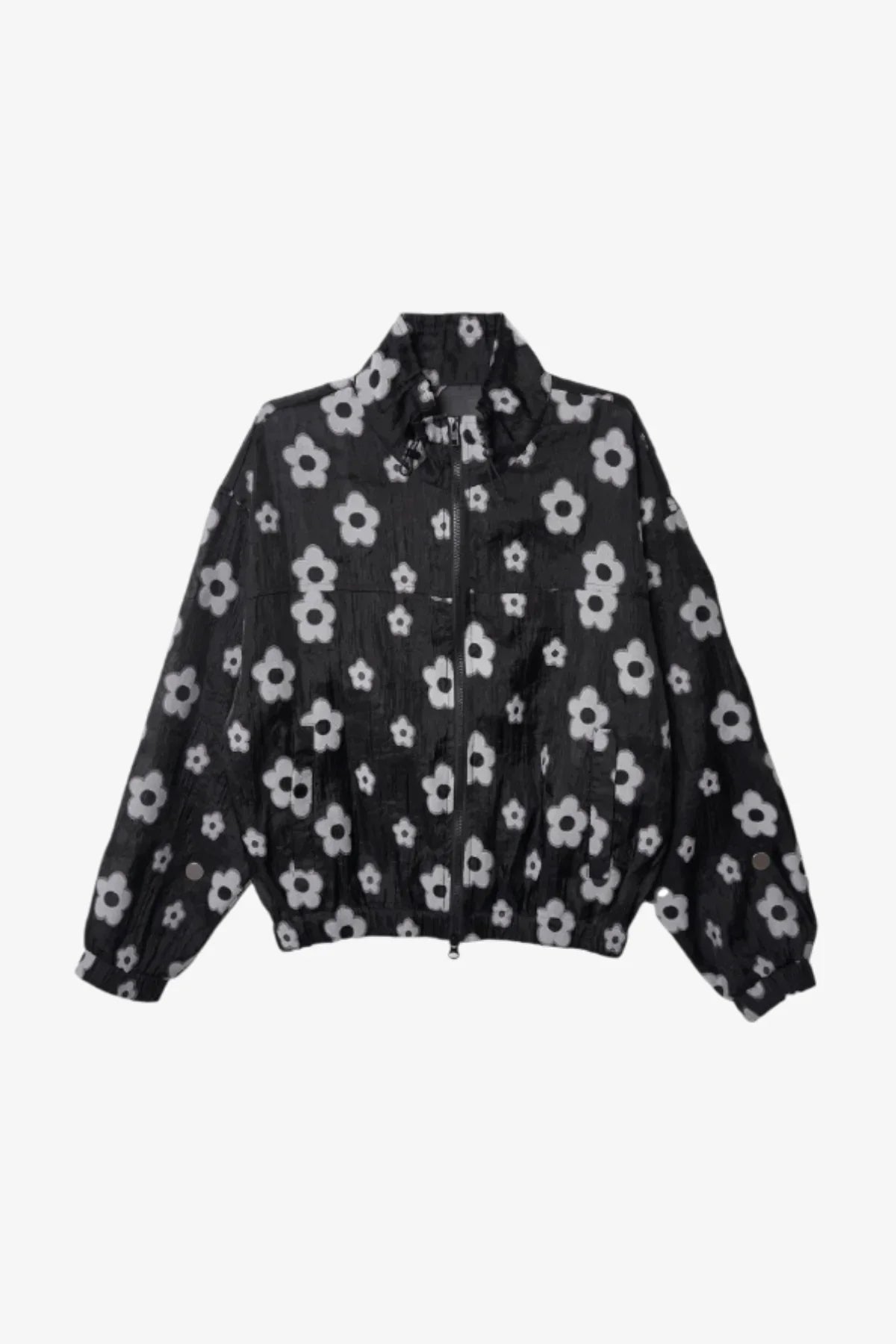 Black zip-up jacket with white flower pattern and elastic cuffs isolated on white