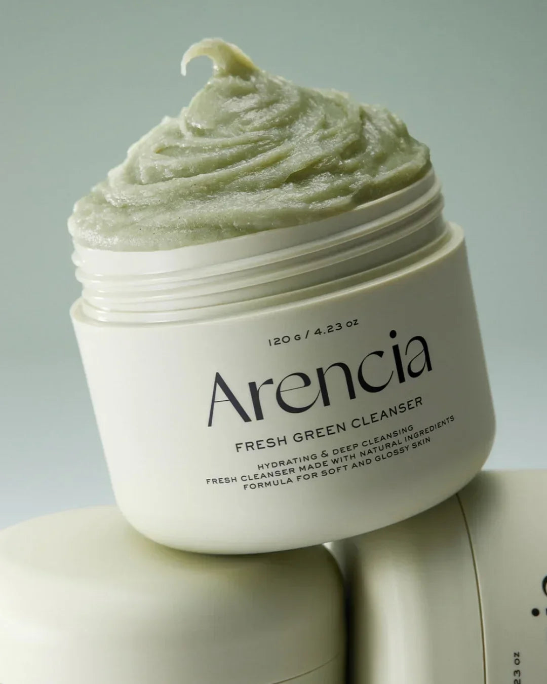 Arencia Fresh Green Cleanser jar with light green creamy texture on a neutral background