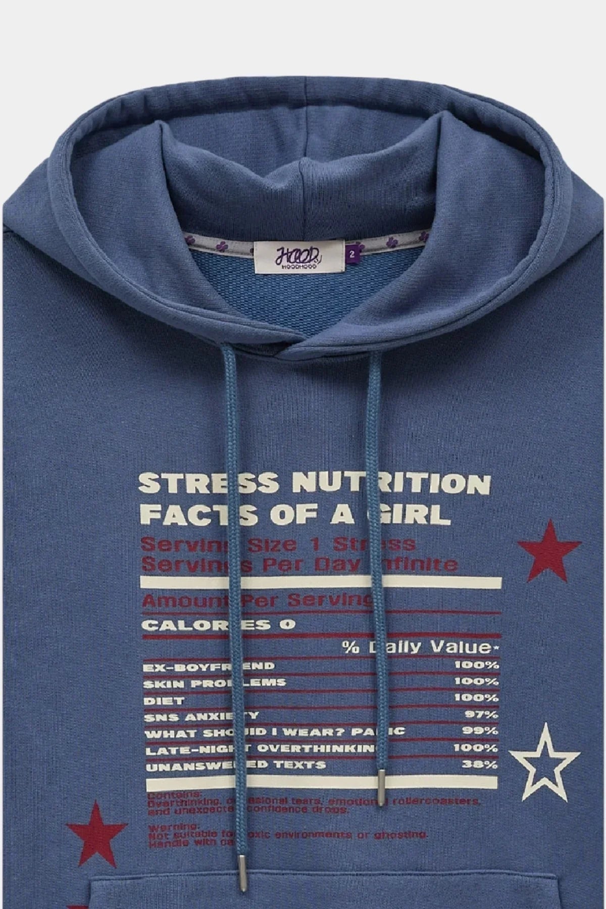 Dust blue hoodie with humorous 'Stress Nutrition Facts of a Girl' text and red and white star graphics