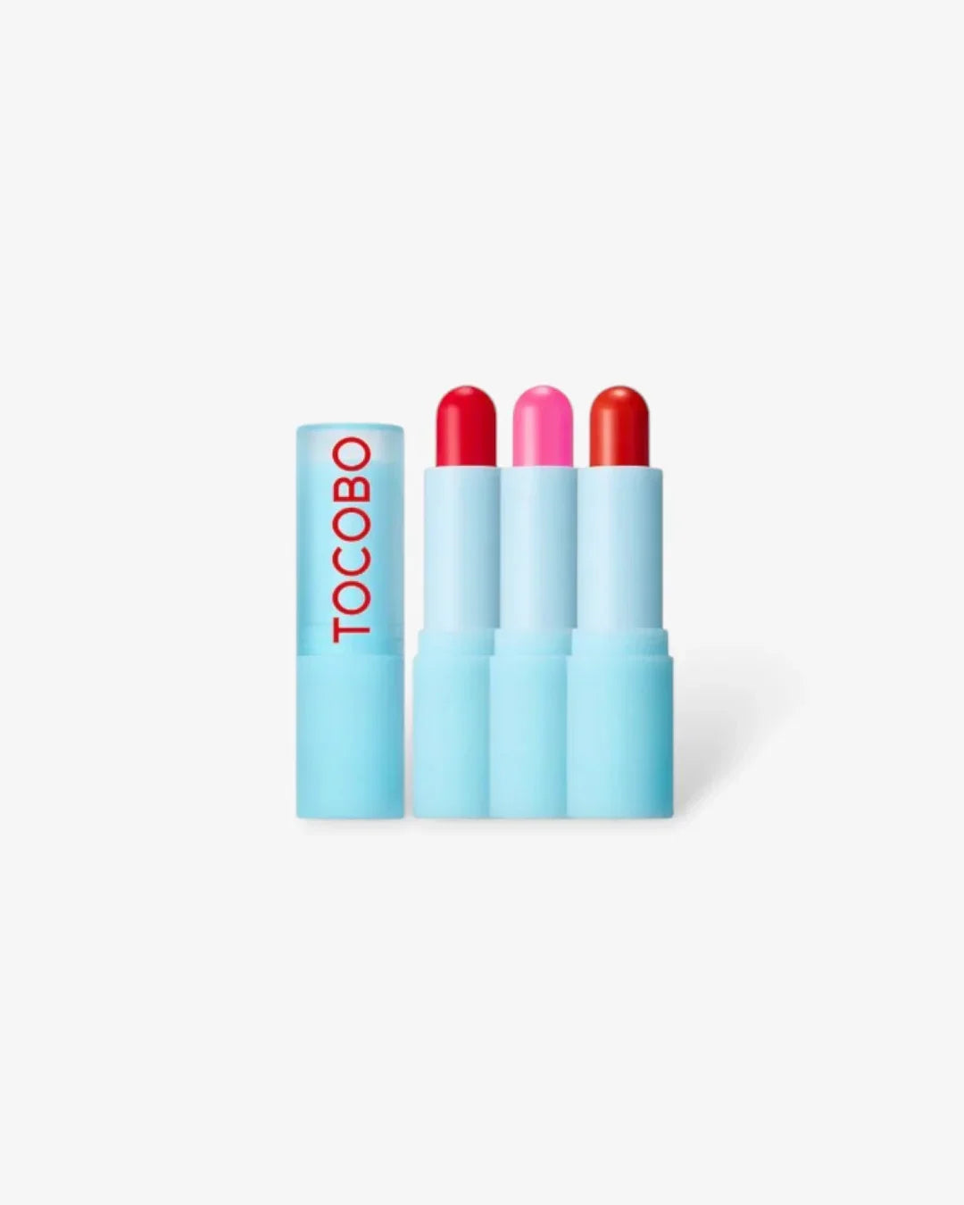 Tocobo tinted lip balm set with three shades of red and pink in light blue tubes on white background