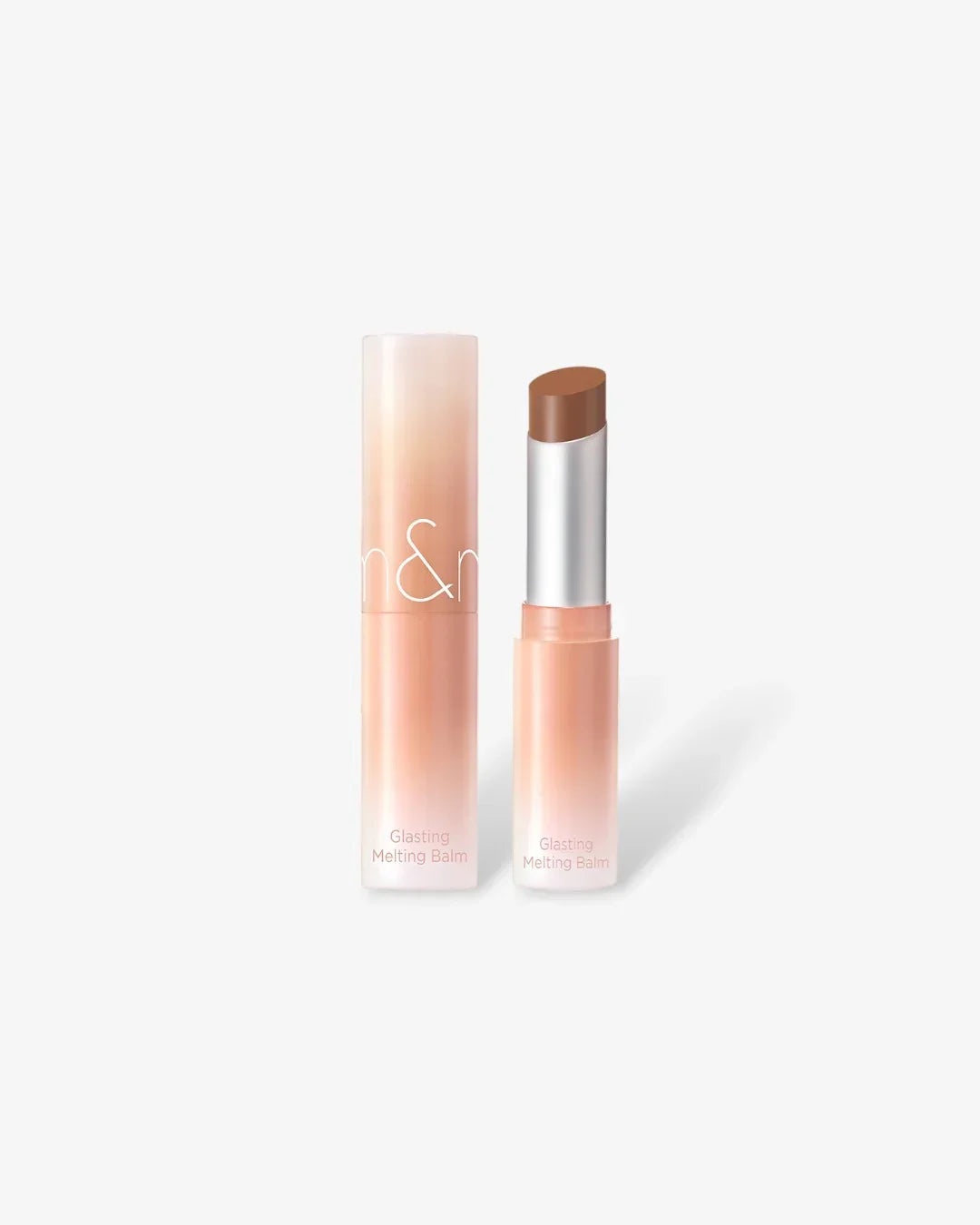 n&m Glasting Melting Balm lip balm in shade 10 Nu Beige with gradient peach packaging