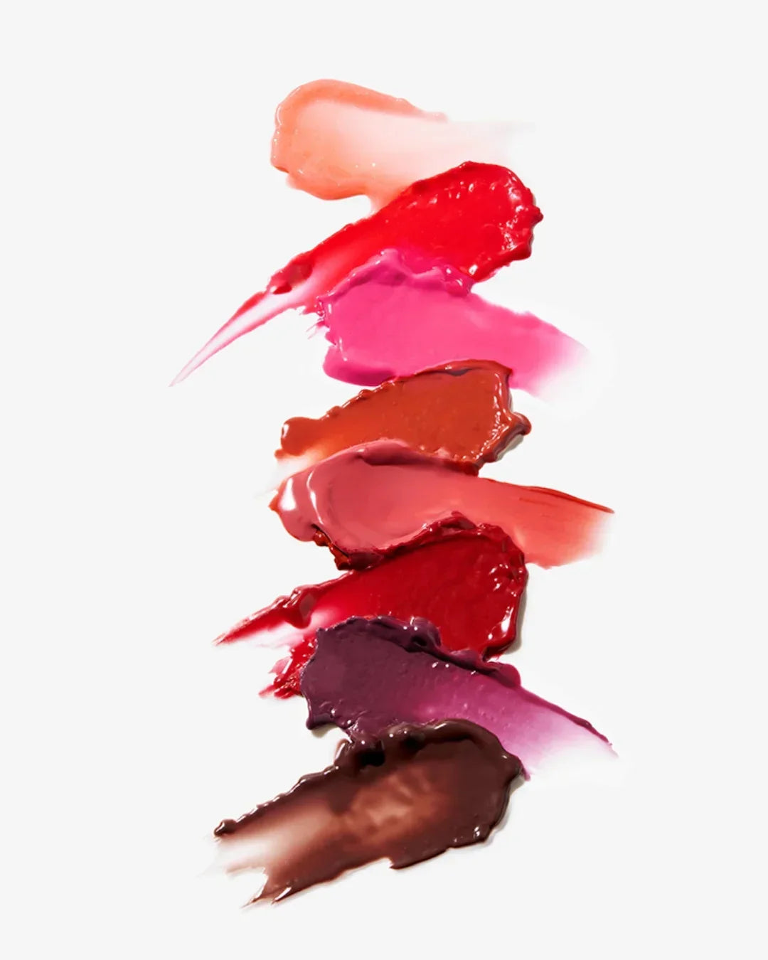 Multiple lipstick swatches in shades of pink, red, brown, and nude on white background