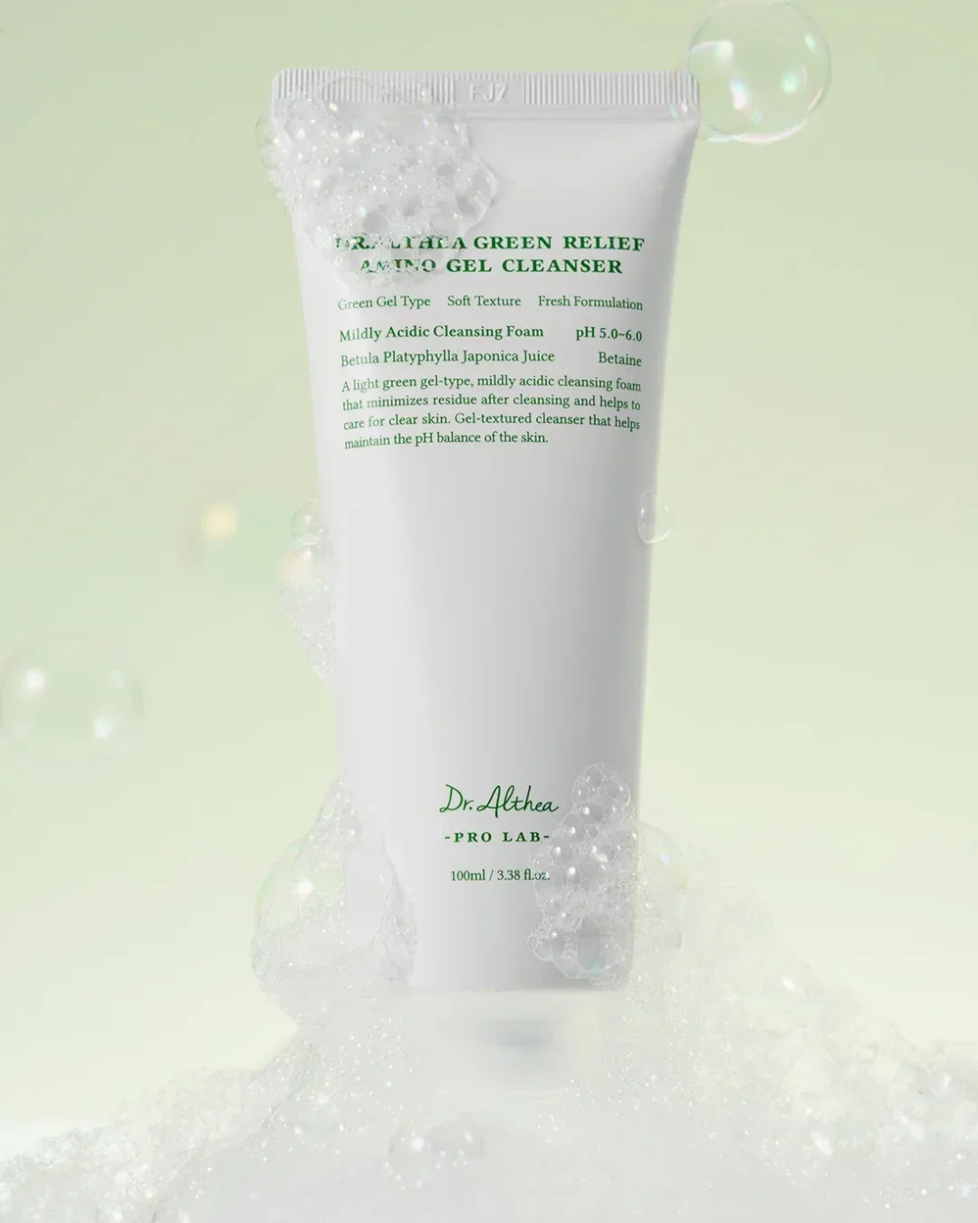 Dr. Althea Green Relief Amino Gel Cleanser with foamy bubbles on light green background