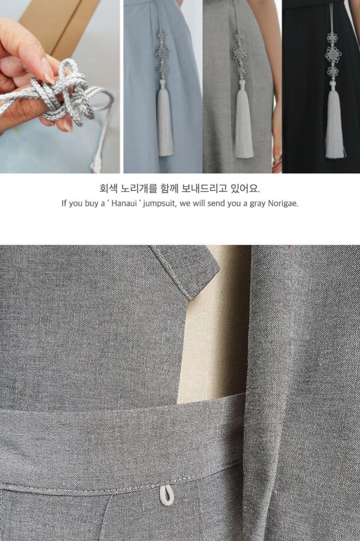 Close-up of gray Hanaui jumpsuit fabric and a gray Norigae tassel accessory included with purchase