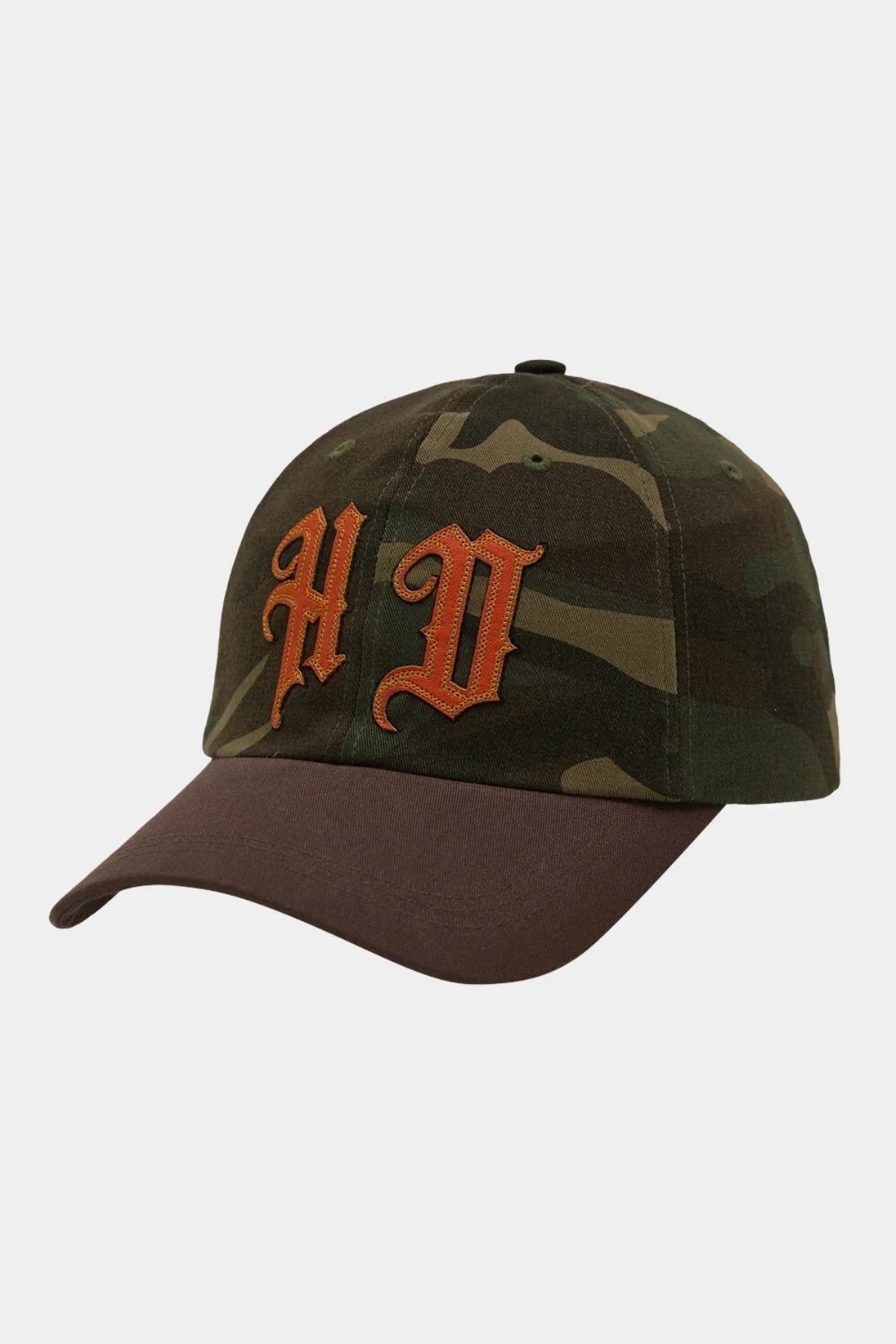 Camo ball cap with khaki brim and orange embroidered applique letters on front
