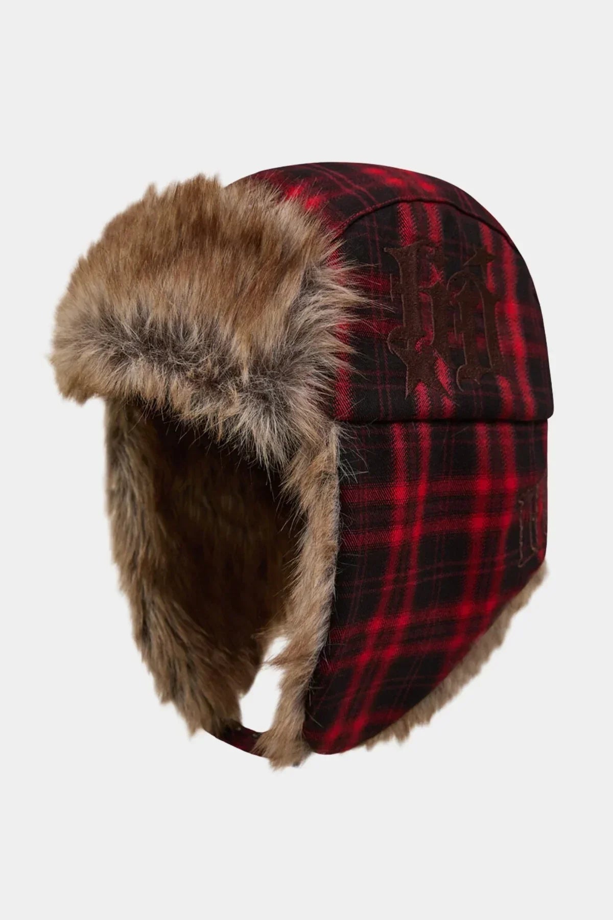 Red and black plaid winter trapper hat with faux fur lining and ear flaps