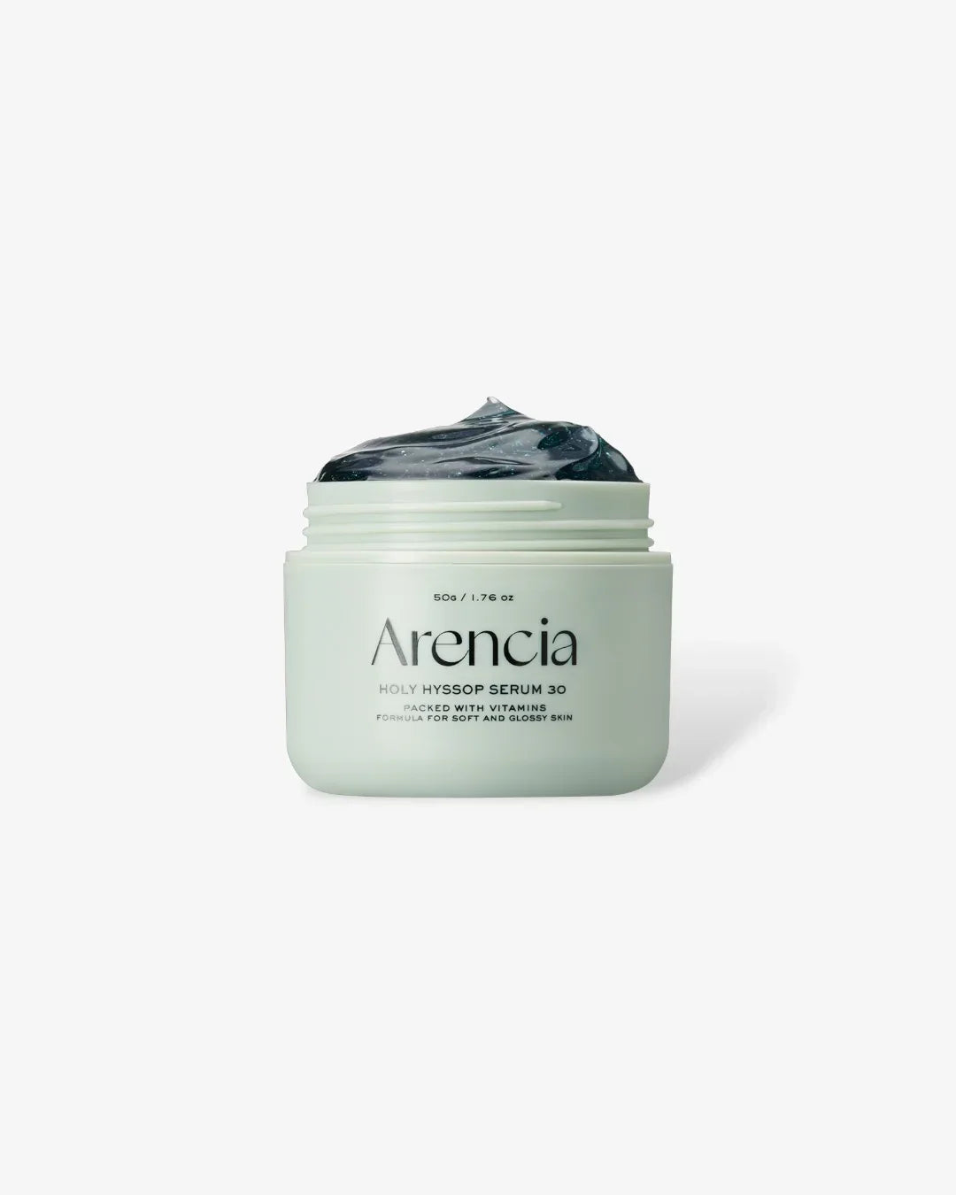 Open jar of Arencia Holy Hyssop Serum 30 with black glossy cream on white background