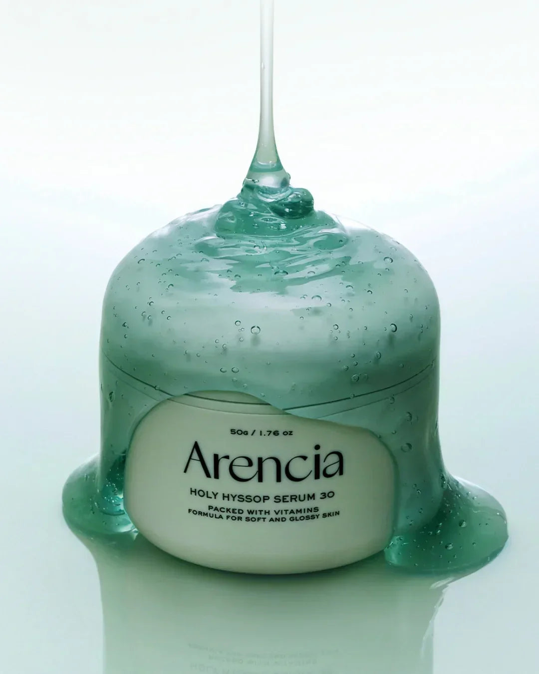 Arencia Holy Hyssop Serum 30 jar covered with translucent green gel with bubbles