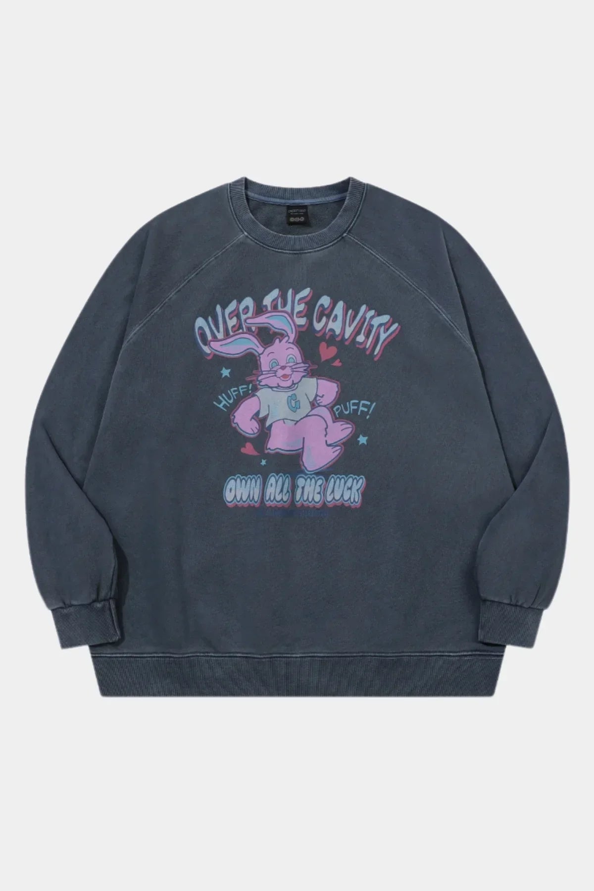Dark blue raglan sweatshirt with vintage pink cartoon bunny and text 'Over the Cavity, Huff! Puff!, Own All The Luck'