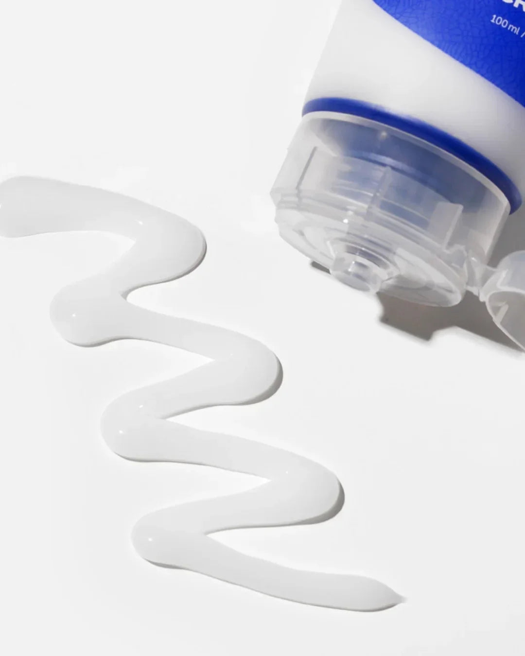 Close-up of hyaluronic acid aqua gel cream tube dispensing white gel on white background