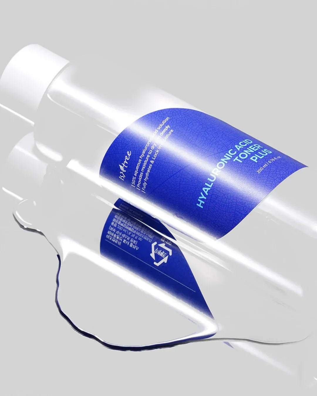 Transparent bottle of 200ml Hyaluronic Acid Toner Plus with blue label on reflective surface