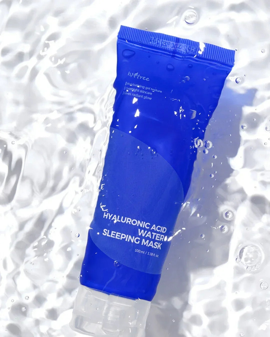 Blue tube of Isntree Hyaluronic Acid Water Sleeping Mask in clear water with bubbles