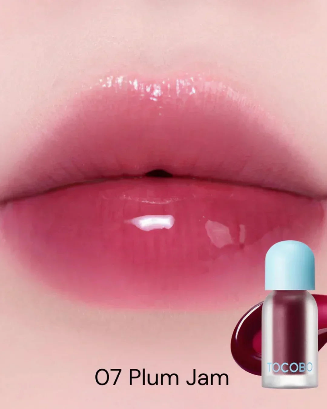 Close-up of glossy lips wearing TOCOBO Juicy Berry Plumping Lip Oil in 07 Plum Jam shade