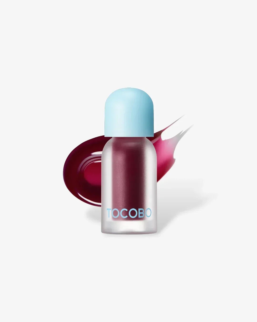TOCOBO plum jam lip oil with light blue cap and berry-colored swatch on white background