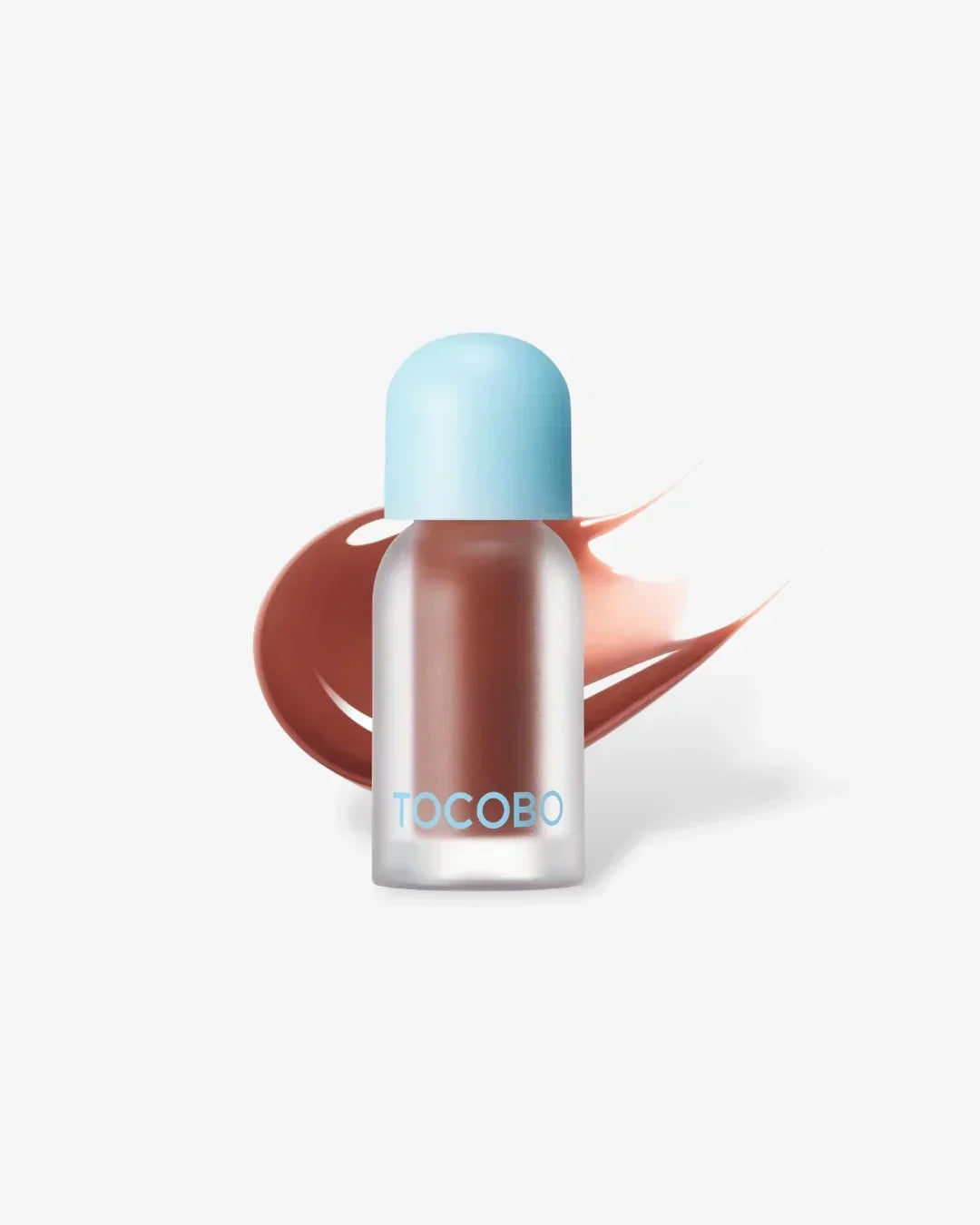 TOCOBO juicy berry plumping lip oil in a frosted bottle with blue cap and brown lip oil smear