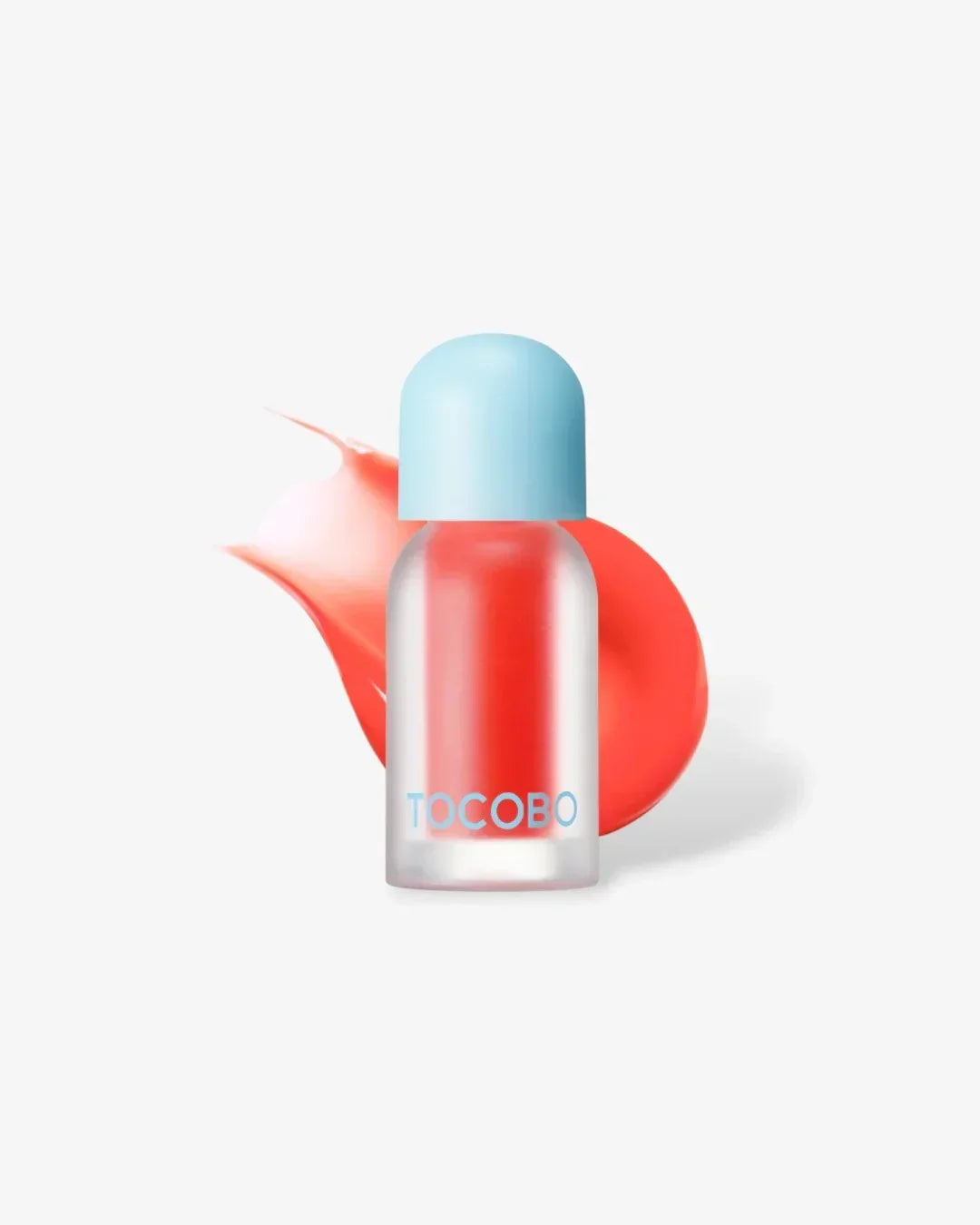 TOCOBO Juicy Berry Plumping Lip Oil bottle with coral shade and blue cap on white background