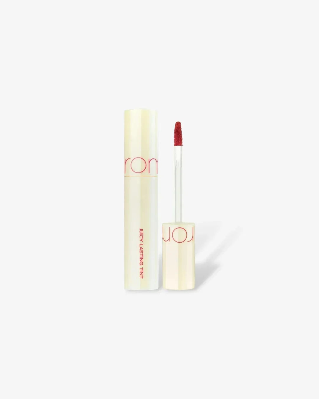 Juicy Lasting Tint lip gloss in Papaya Jam shade with applicator wand on white background