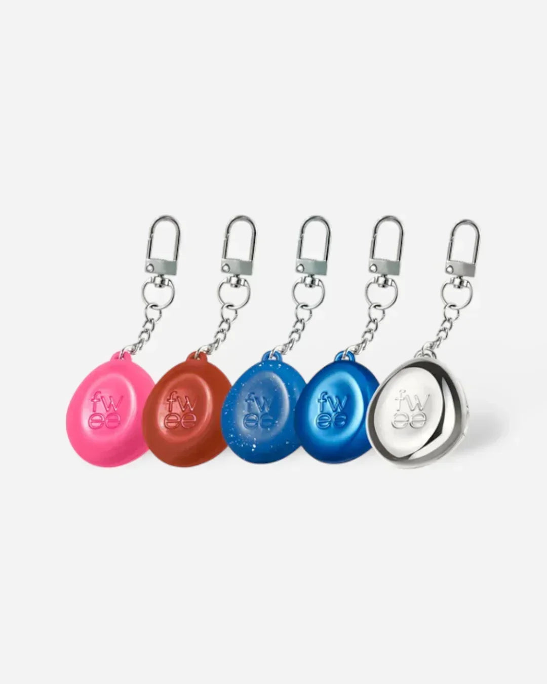 Five colorful fwee branded keyring lip and cheek pudding pot holders with metal clips in pink, brown, two shades of blue, and silver