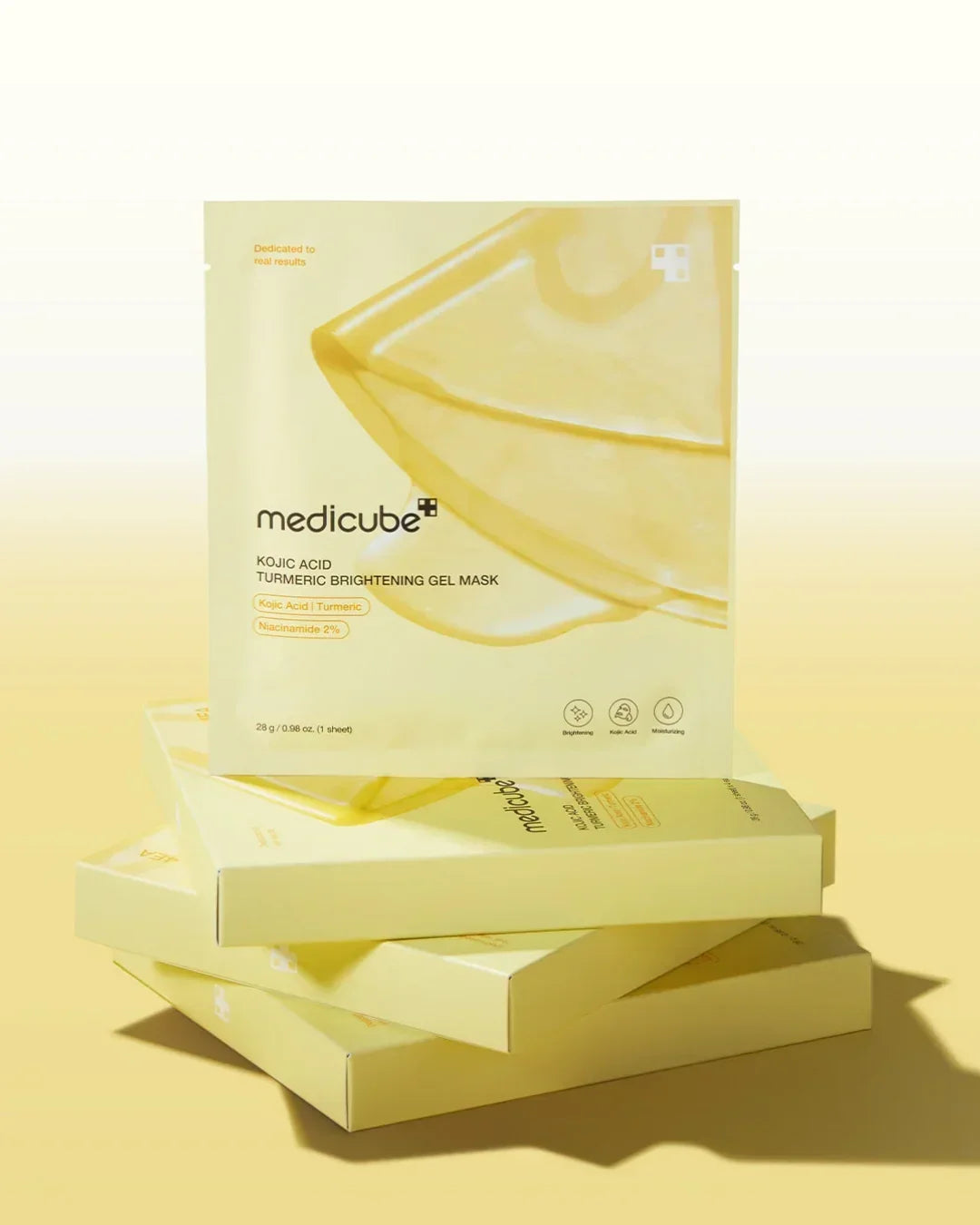 Medicube Kojic Acid Turmeric Brightening Gel Mask packaging stacked with yellow gradient background
