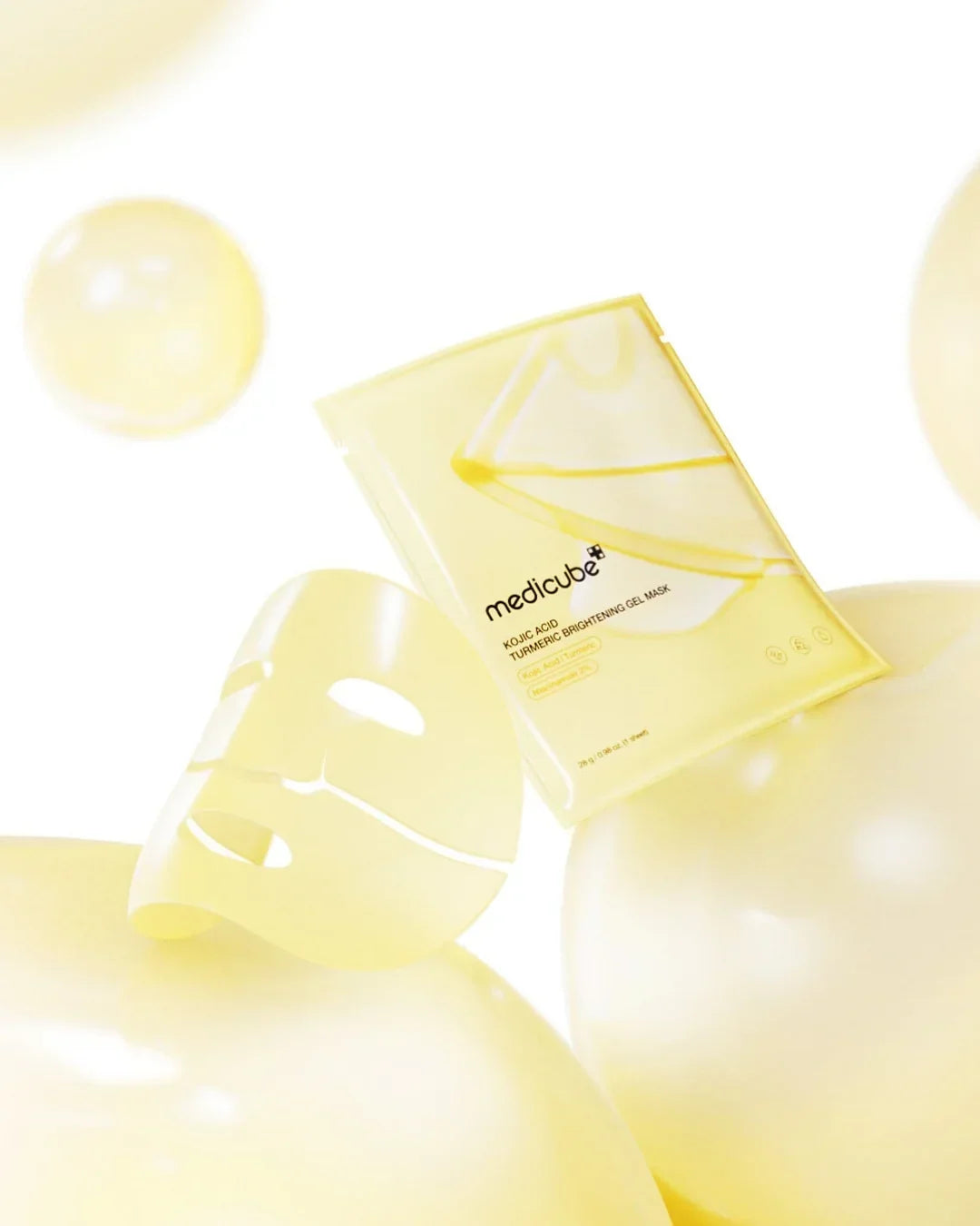 medicube Kojic Acid Turmeric Brightening Gel Mask with yellow facial mask and balloons