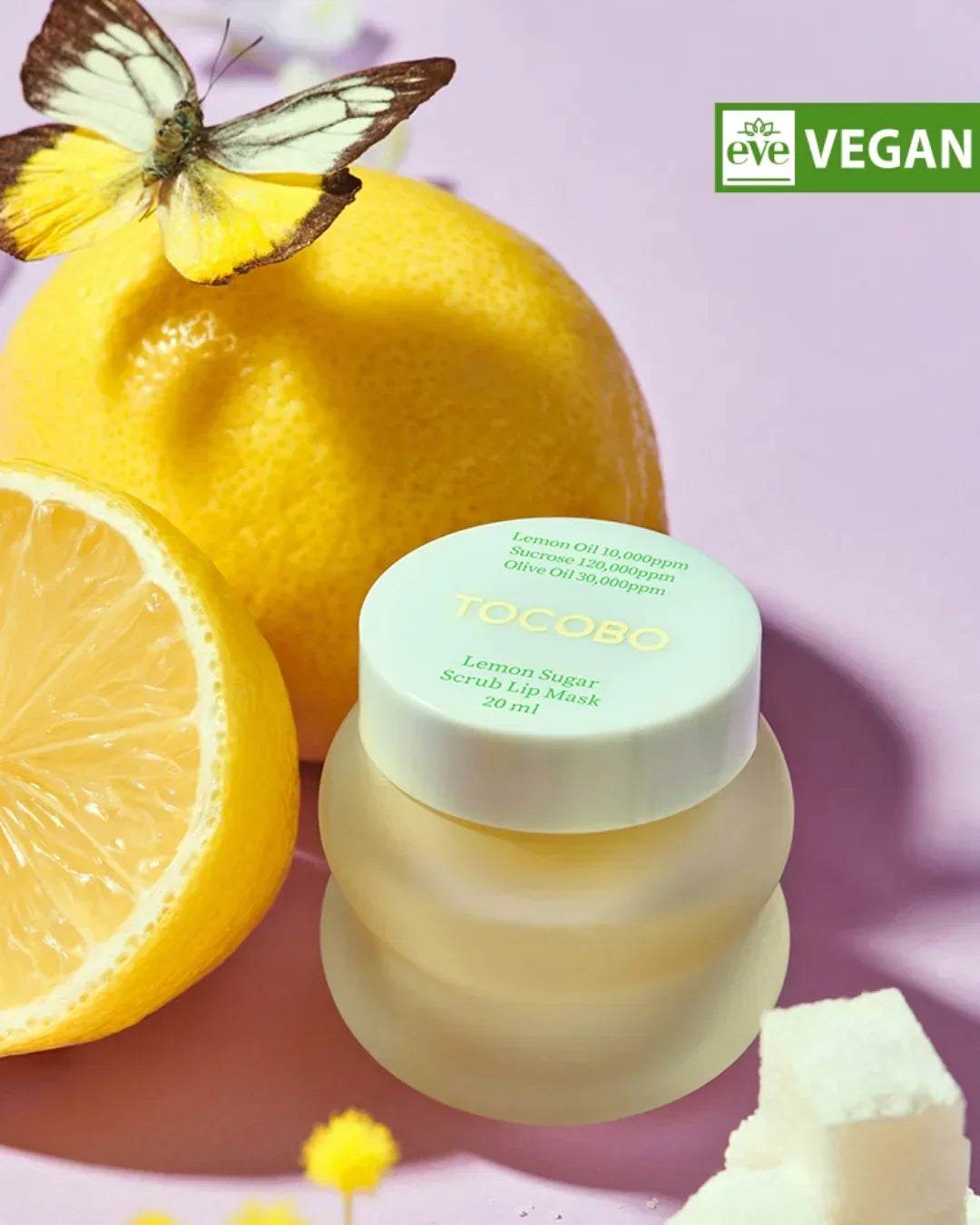 Tocobo Lemon Sugar Scrub Lip Mask jar with lemon, butterfly, and vegan label on purple background