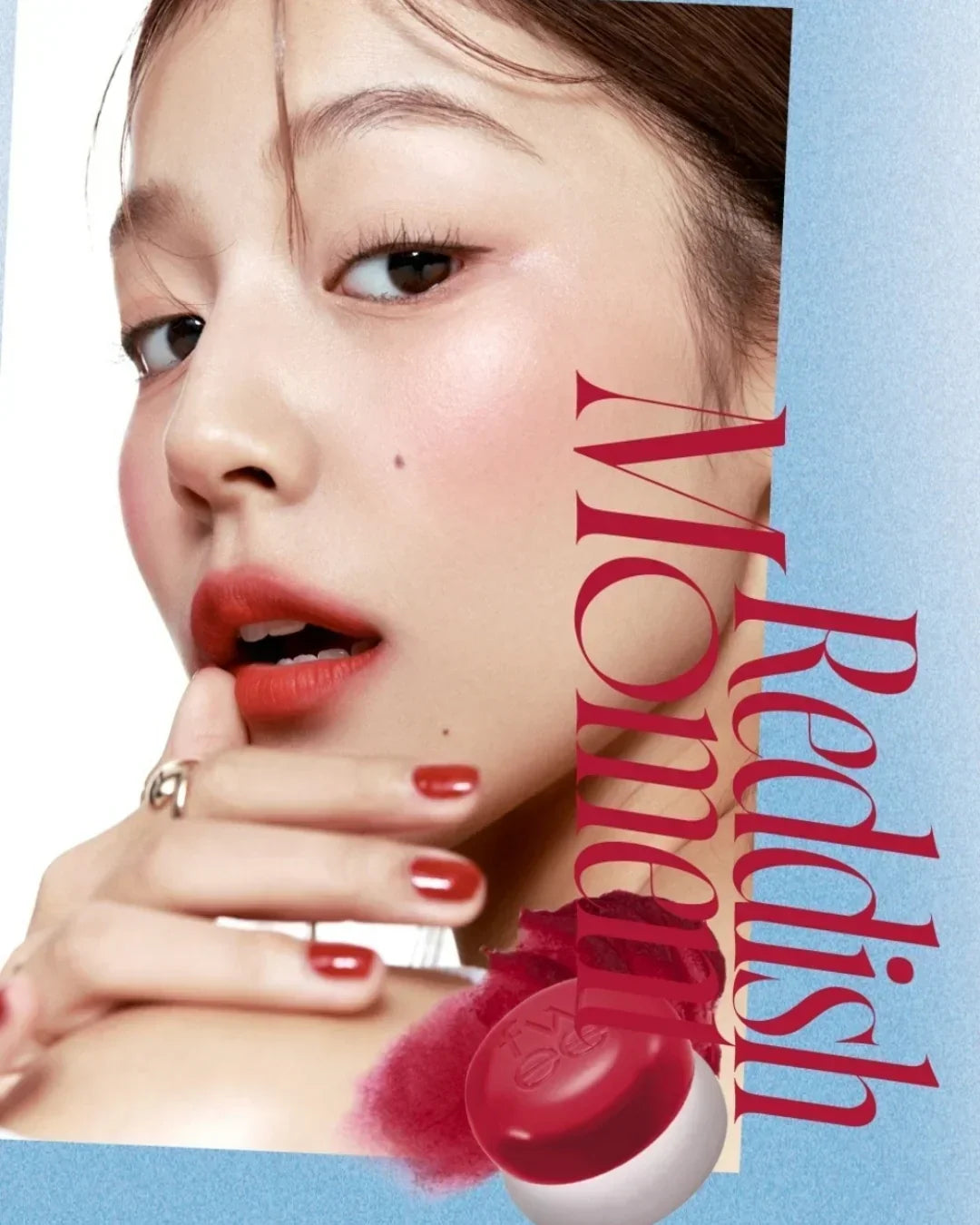 Close-up of woman with red lipstick and matching nail polish, promoting redish mood makeup with cosmetic pot