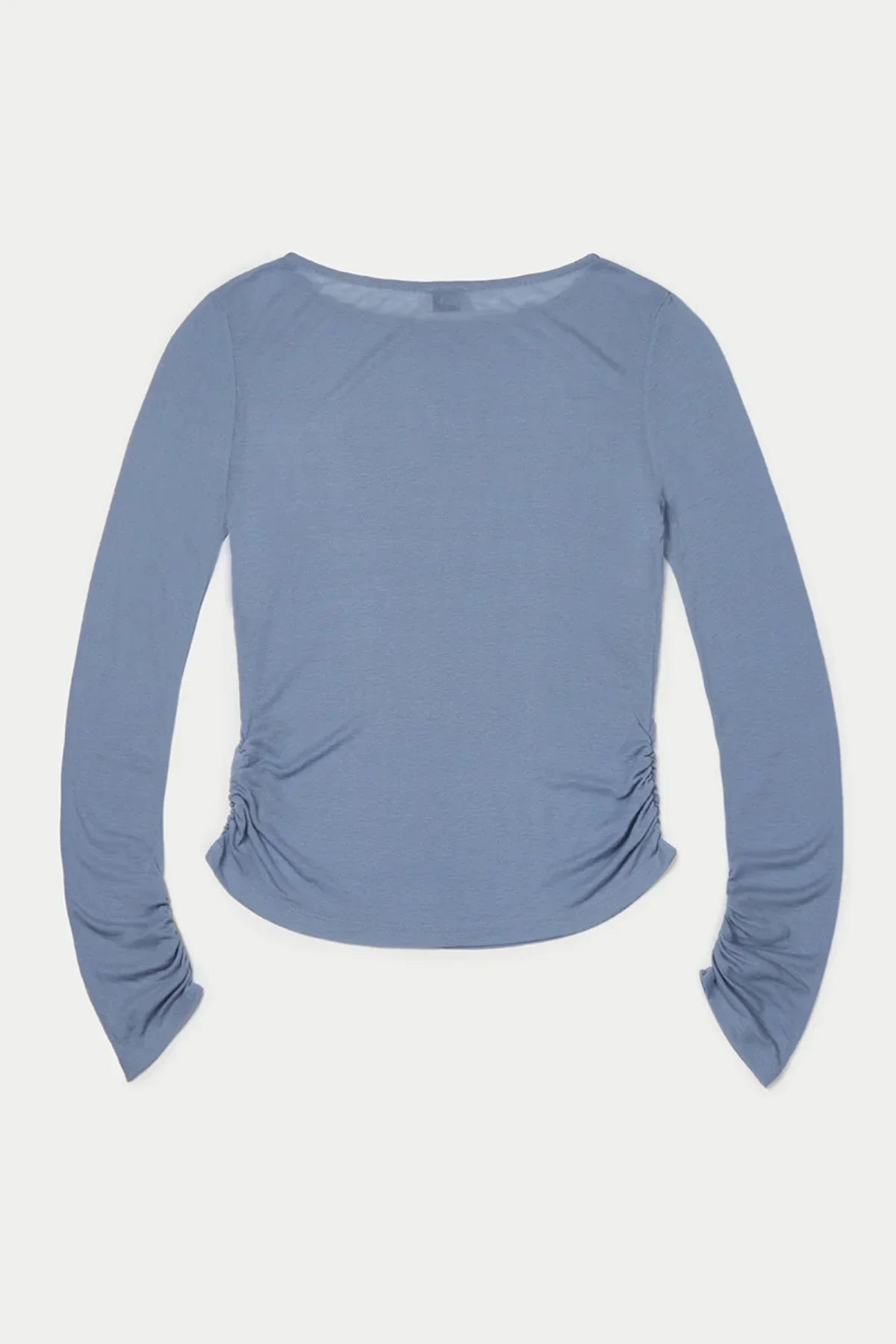 Loose fit long sleeve top in cloudy blue with side ruching, flat lay on white background