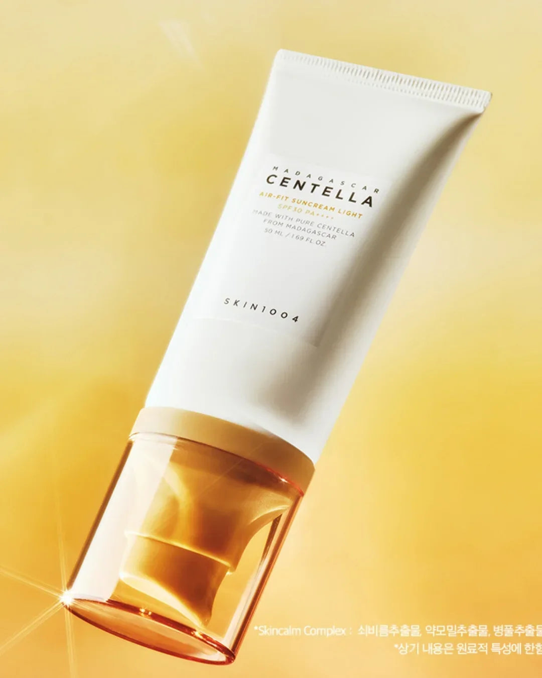 Skin1004 Madagascar Centella Air-Fit Suncream Light SPF30 PA+++ in white tube with amber cap on yellow background