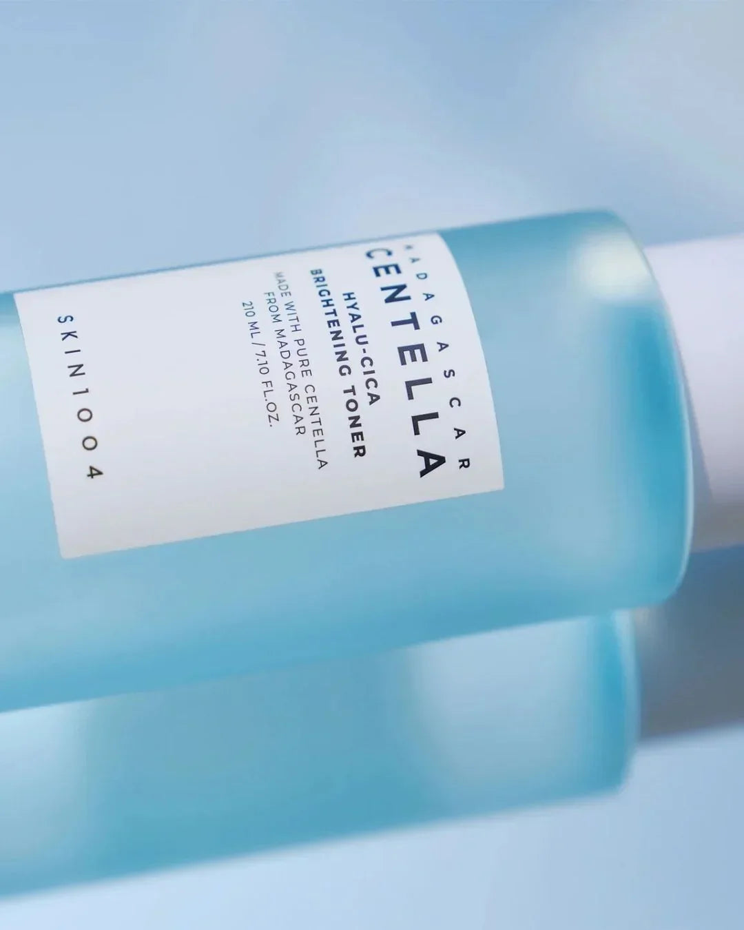 Madagascar Centella Hyalu-Cica Brightening Toner 210ml bottle on light blue background