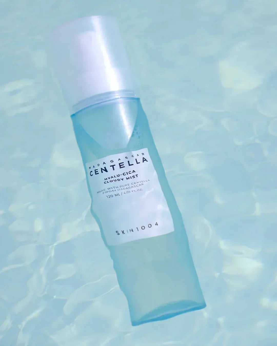 Skin1004 Madagascar Centella Hyalu-Cica Cloudy Mist 120ml bottle floating in clear water