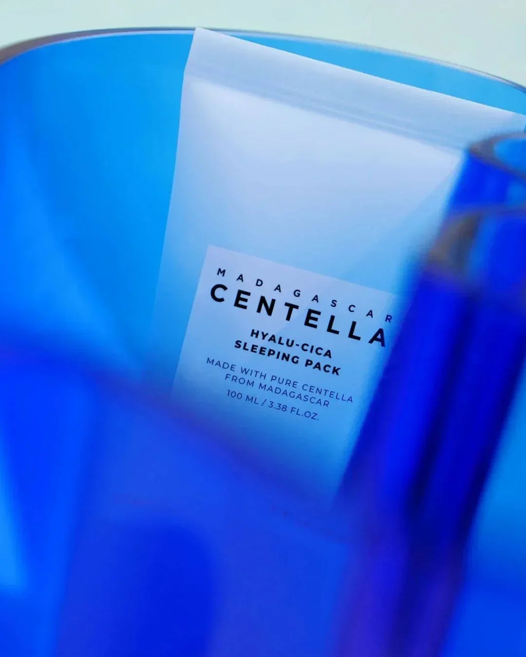 Madagascar Centella Hyalu-Cica Sleeping Pack 100ml skincare product in a blue translucent container