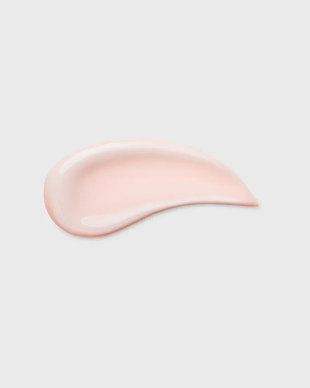 Smooth light pink skincare cream texture on white background