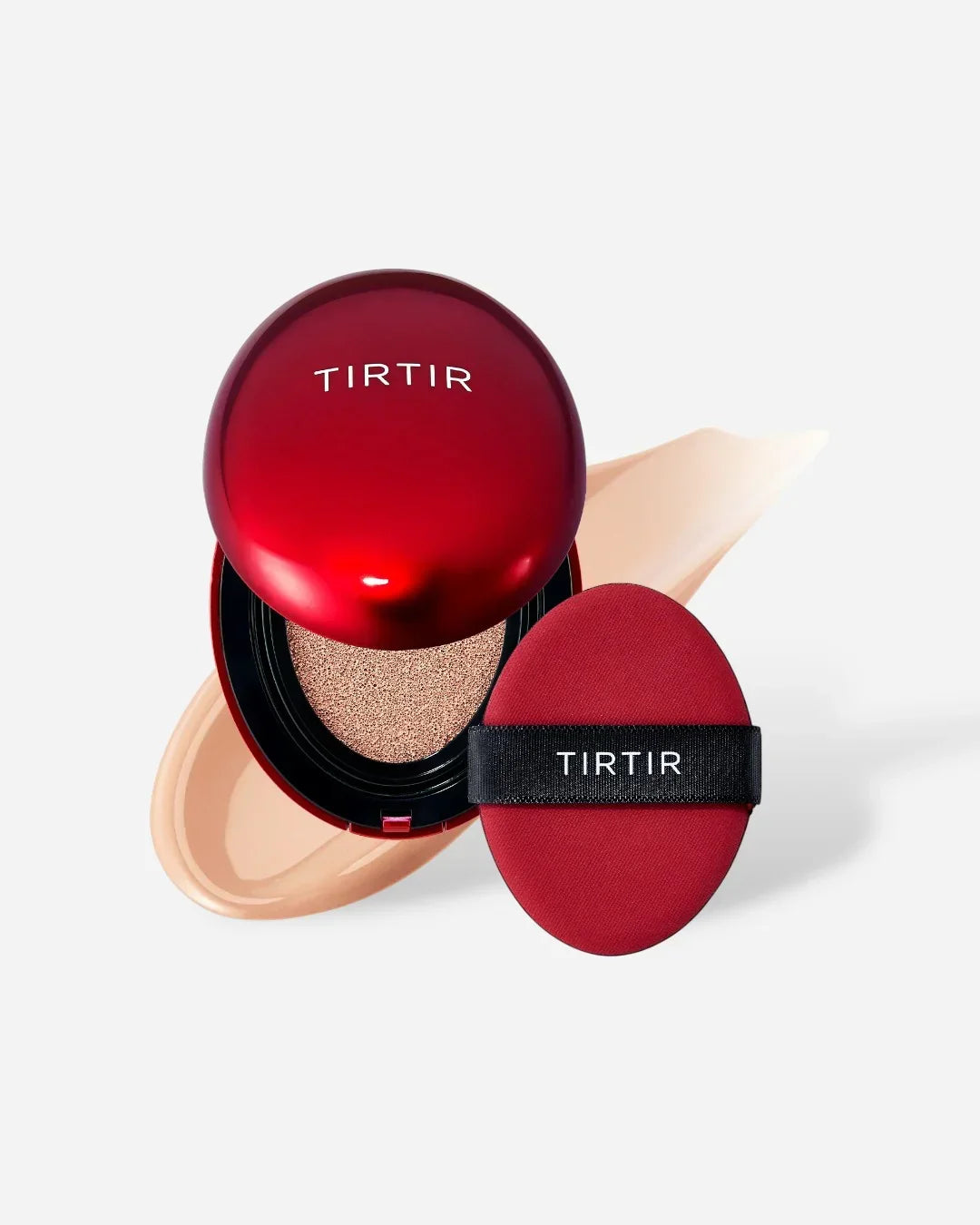 Red TIRTIR cushion compact and red applicator sponge with beige foundation smear on white background