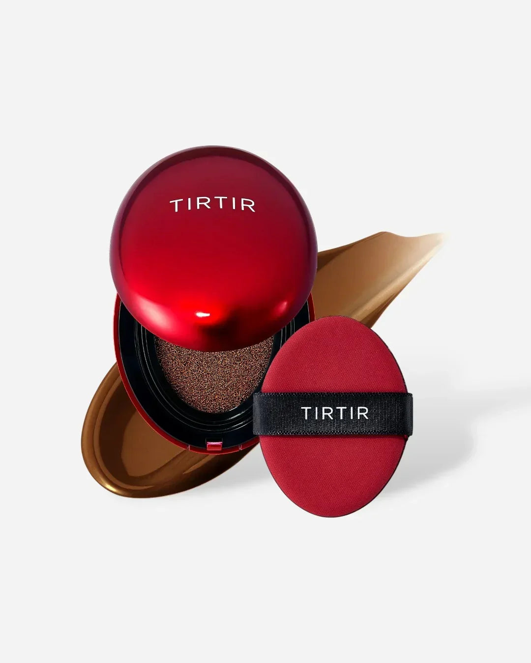 TIRTIR red cushion foundation compact with applicator sponge and beige foundation smear on white background
