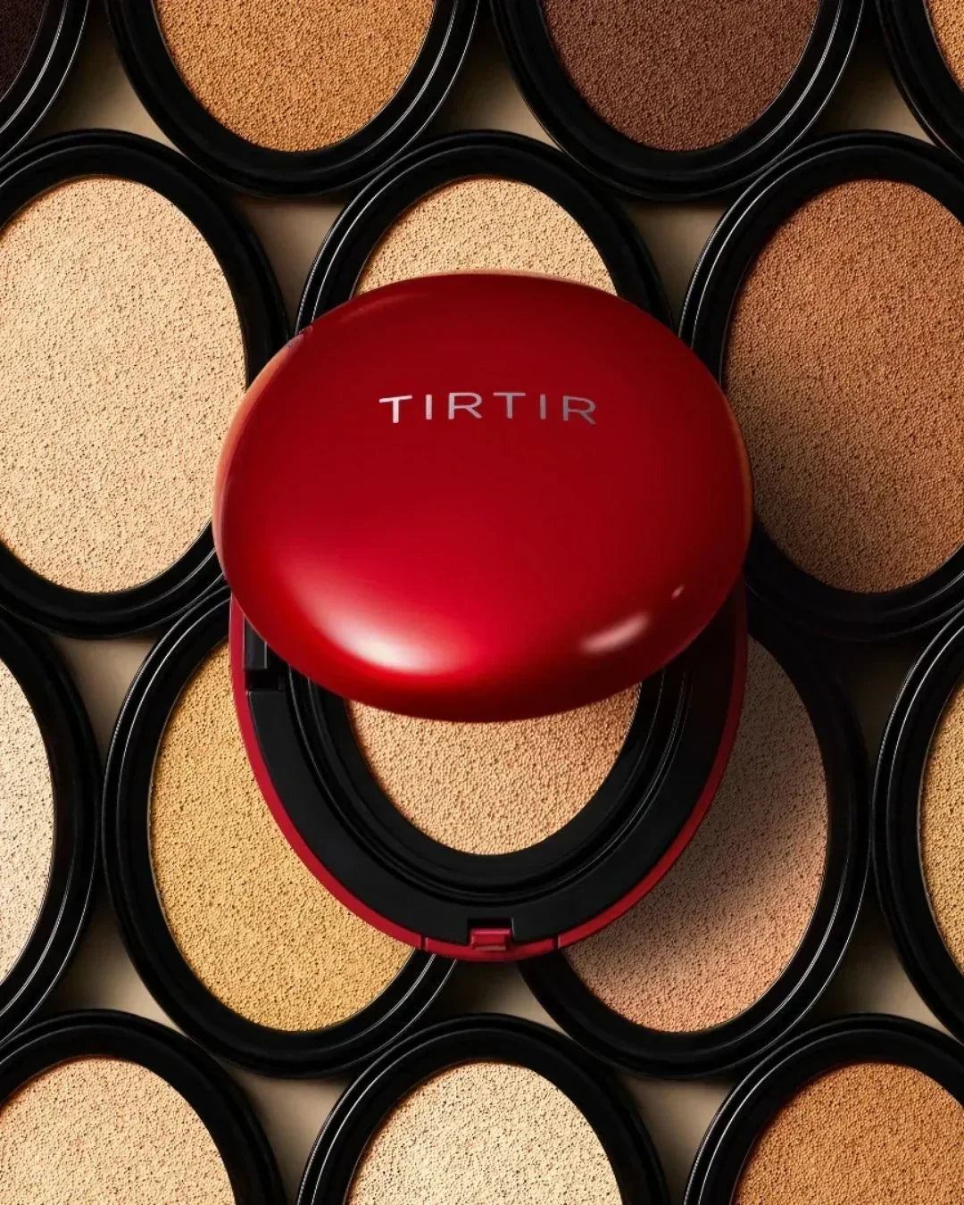 Red Tirtir cushion compact on beige and brown cushion foundation powders in black cases
