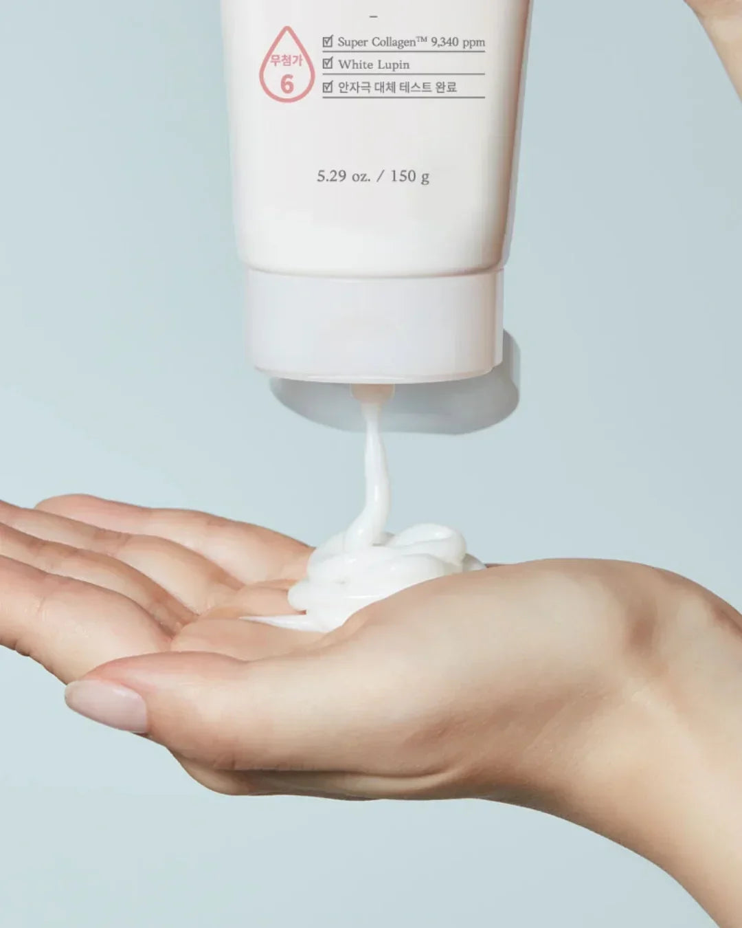 Moistfull Collagen Cleansing Foam Squeeze with white creamy foam on hand, 150g skincare product