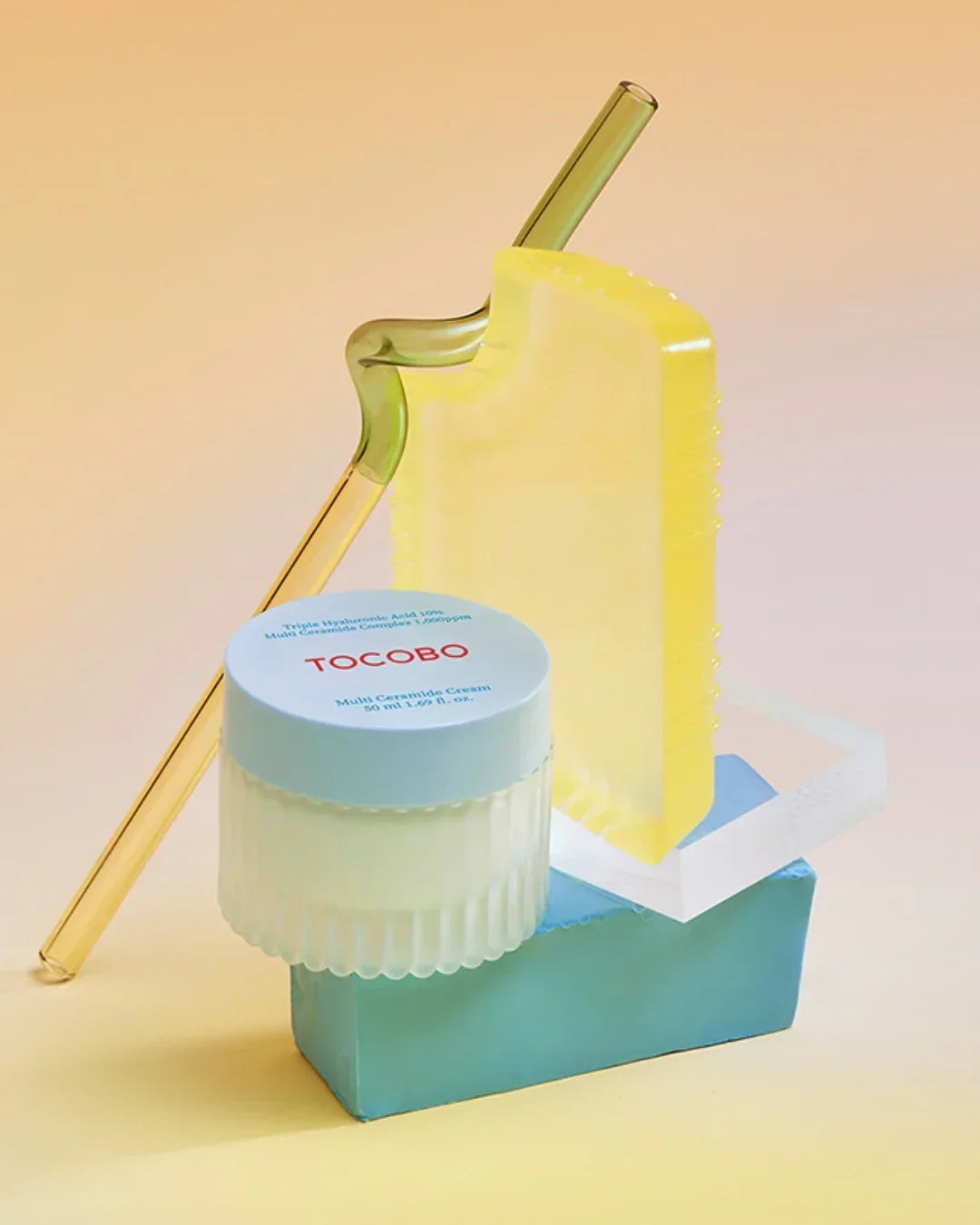 TOCOBO Multi Ceramide Cream 50ml jar with clear yellow cream applicator on pastel background