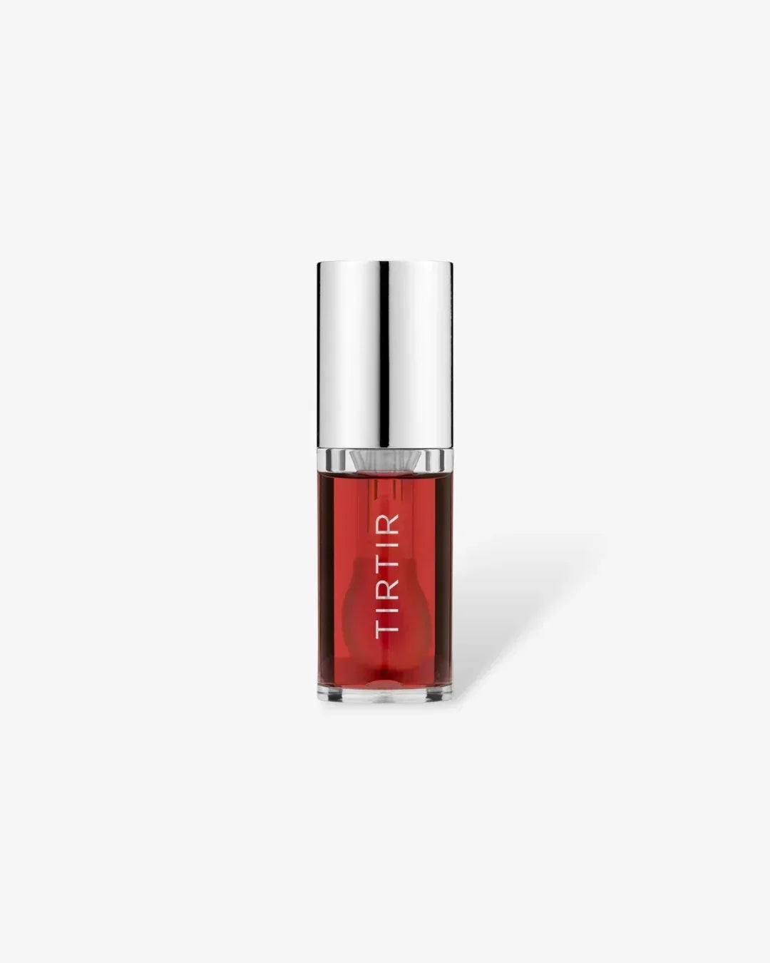 TIRTIR lip oil in transparent bottle with red tint and silver cap on white background
