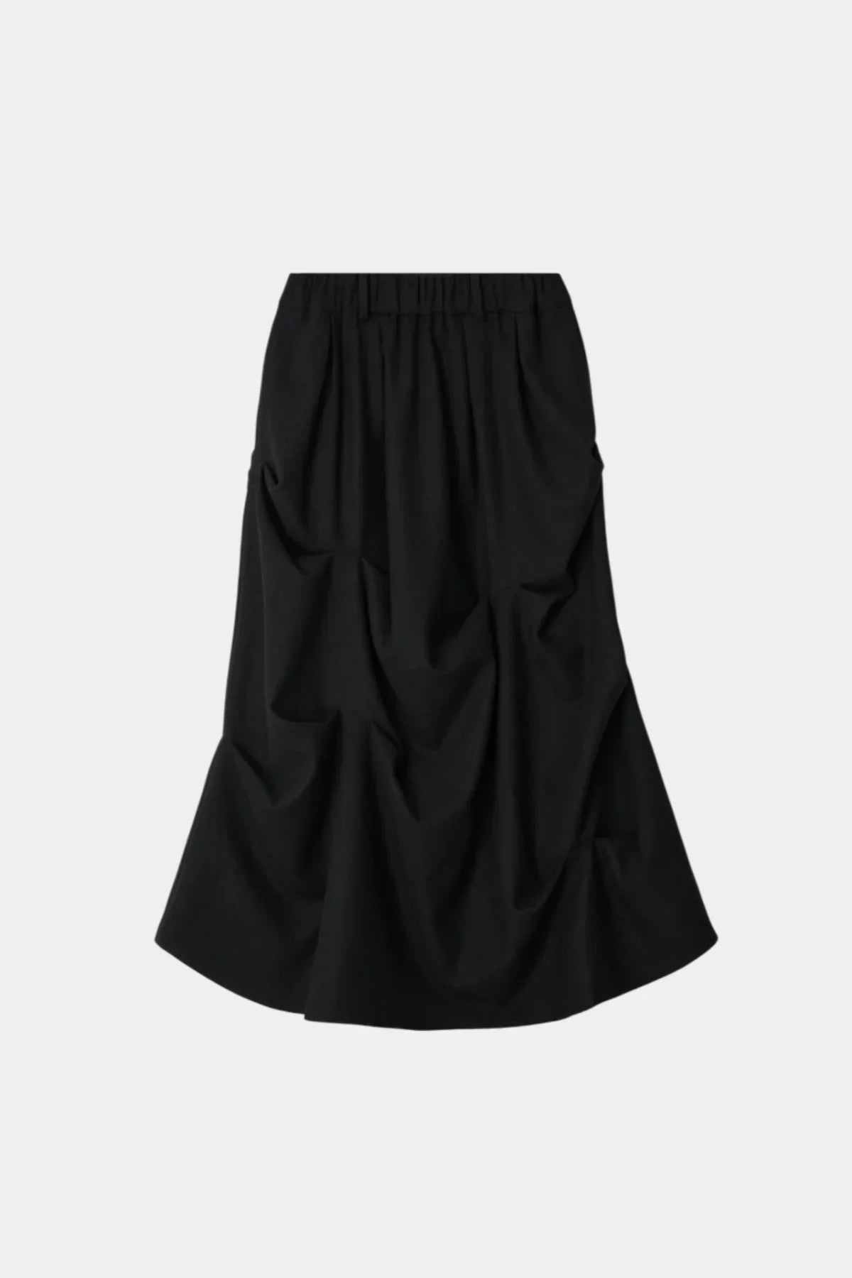 Black curtain skirt with gathered, ruched fabric and elastic waistband on white background