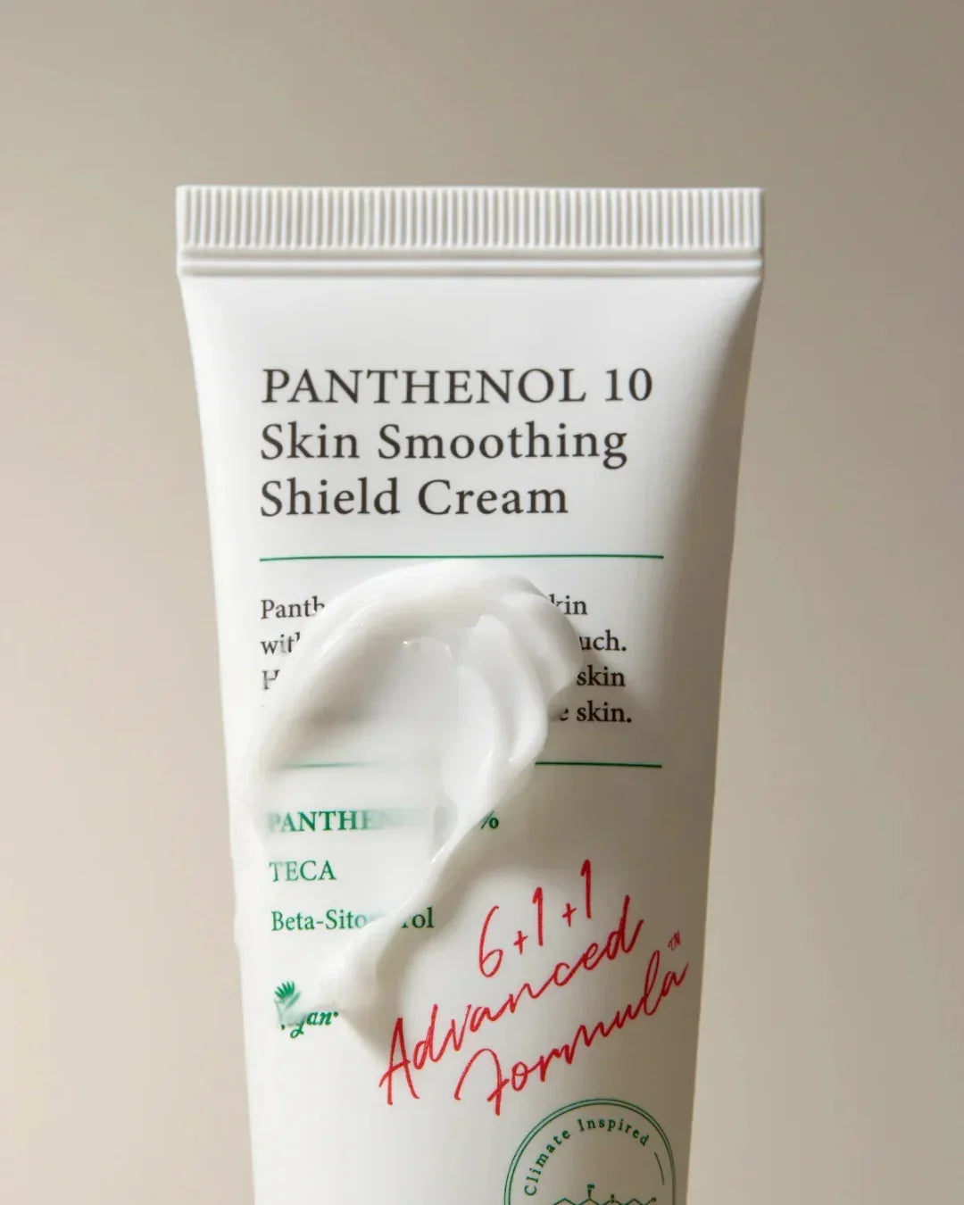 Tube of Panthenol 10 Skin Smoothing Shield Cream with white cream swatch on light beige background