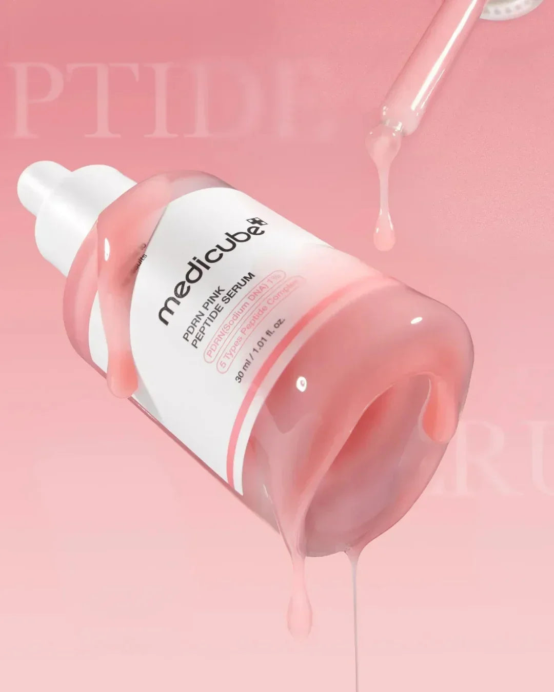 Medicube PDRN Pink Peptide Serum 30ml bottle with pink serum dripping on pink background