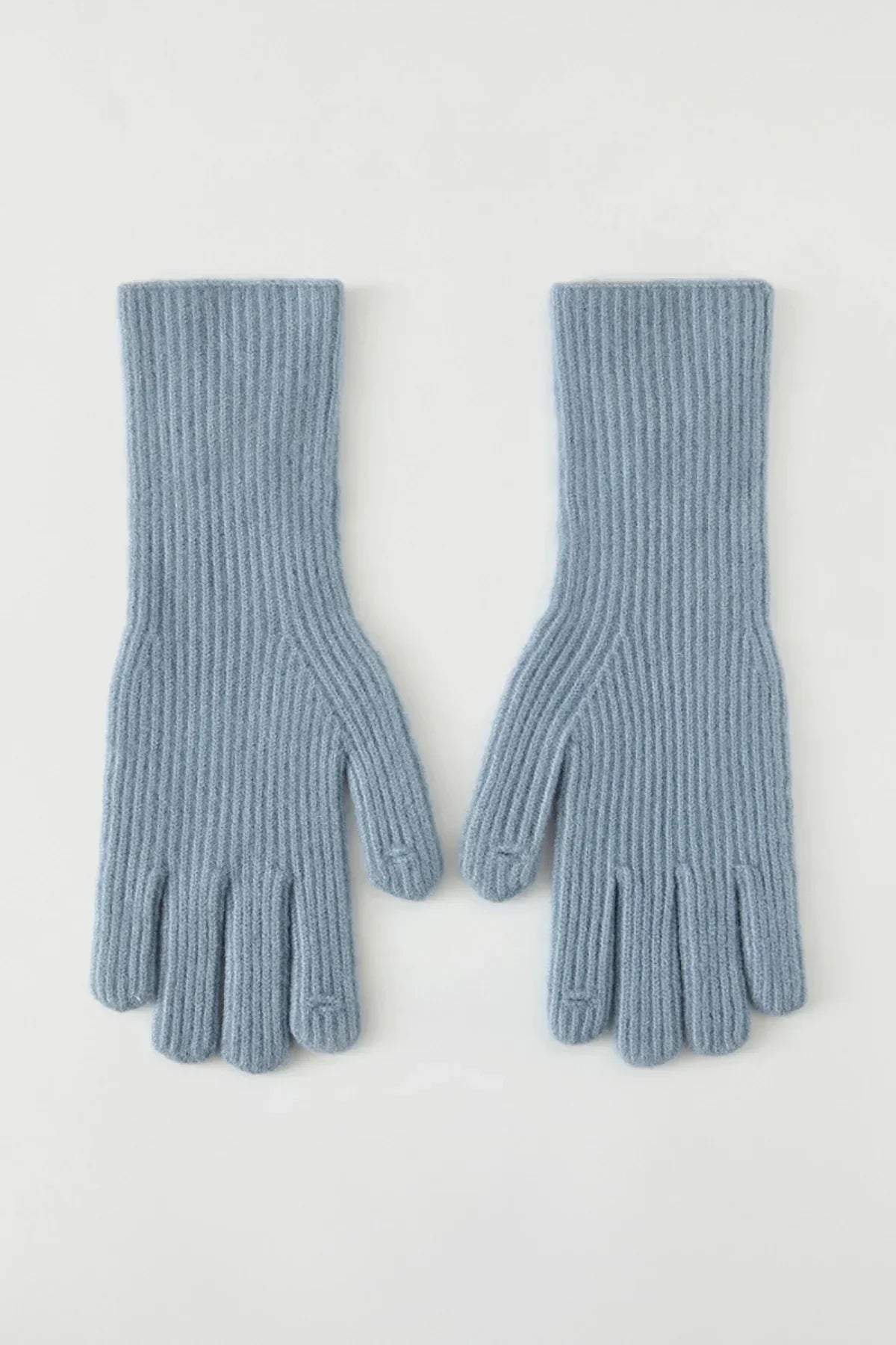 Pair of light blue ribbed knit gloves laid flat on white background