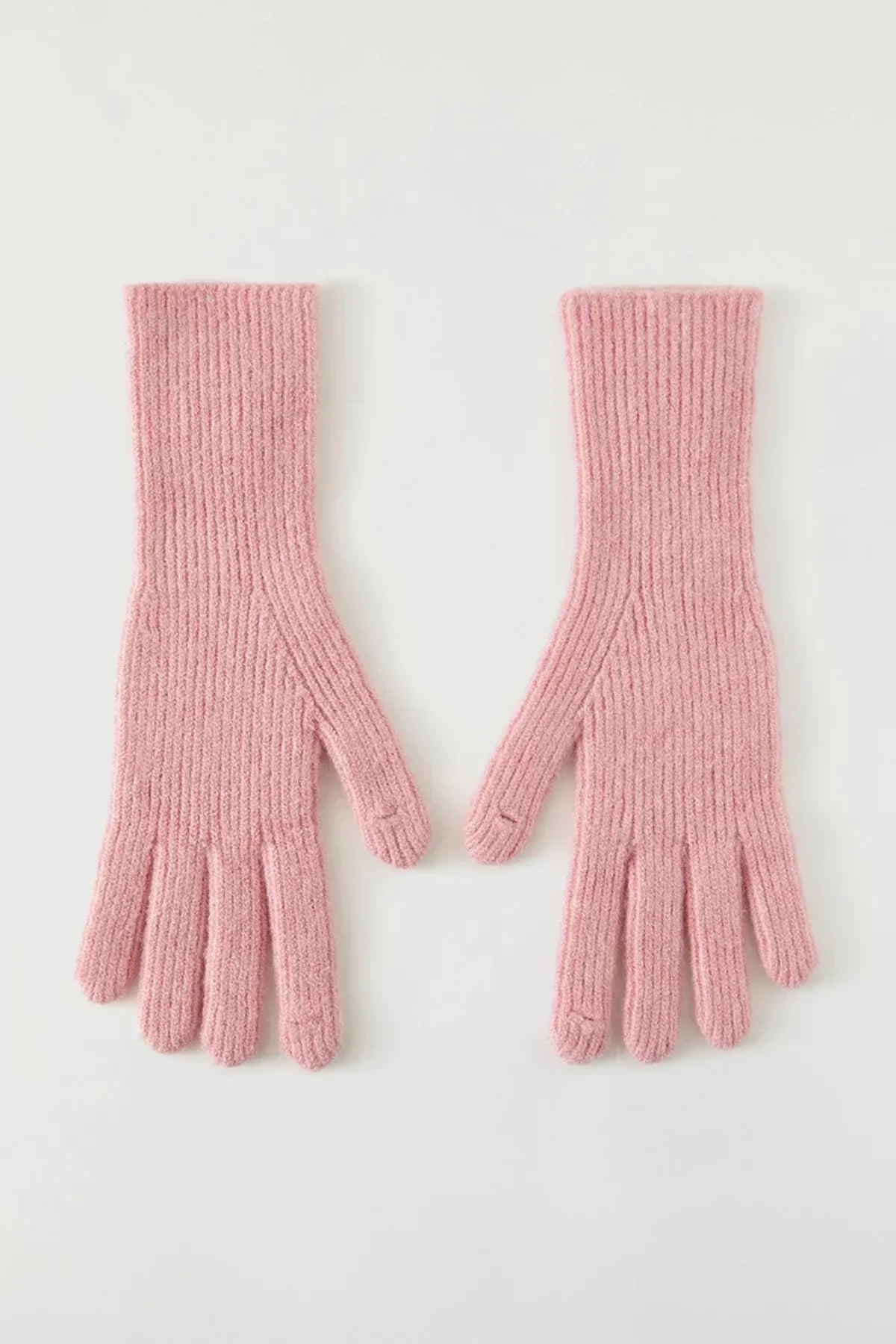 Pair of pink ribbed knit gloves on a white background