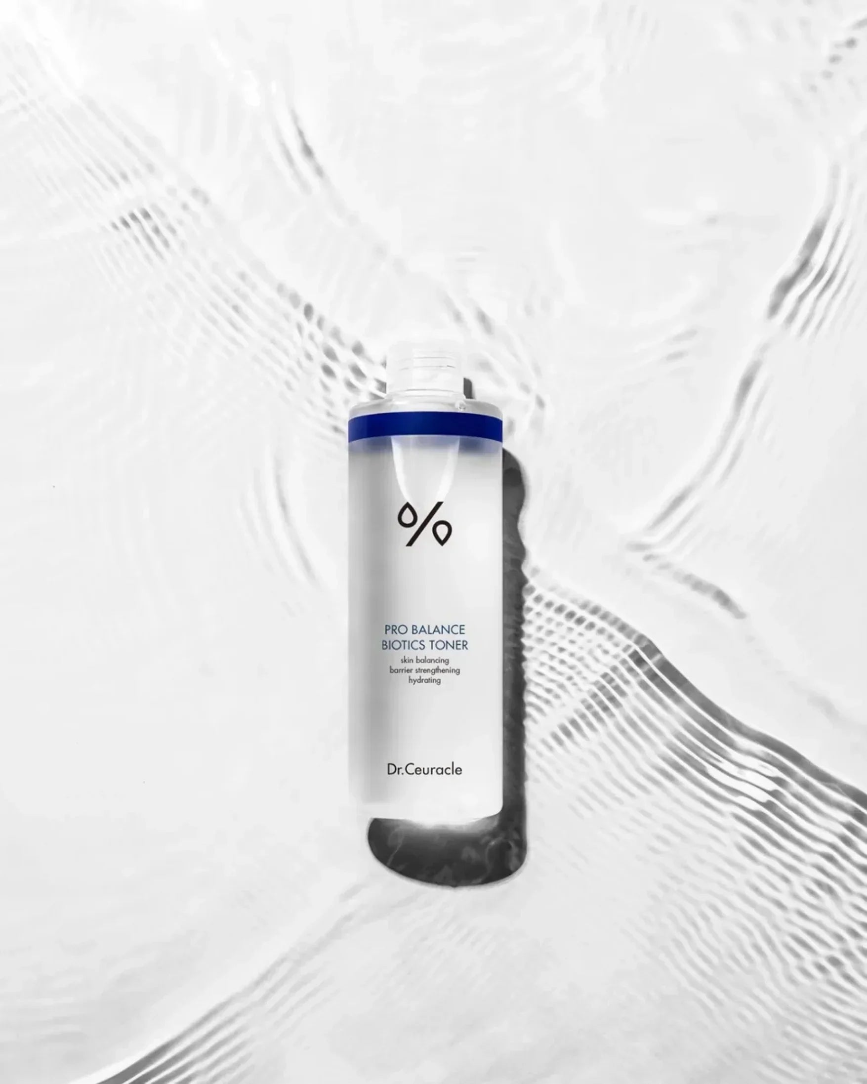 Dr.Ceuracle Pro Balance Biotics Toner 300ml bottle on textured water surface, hydrating skincare